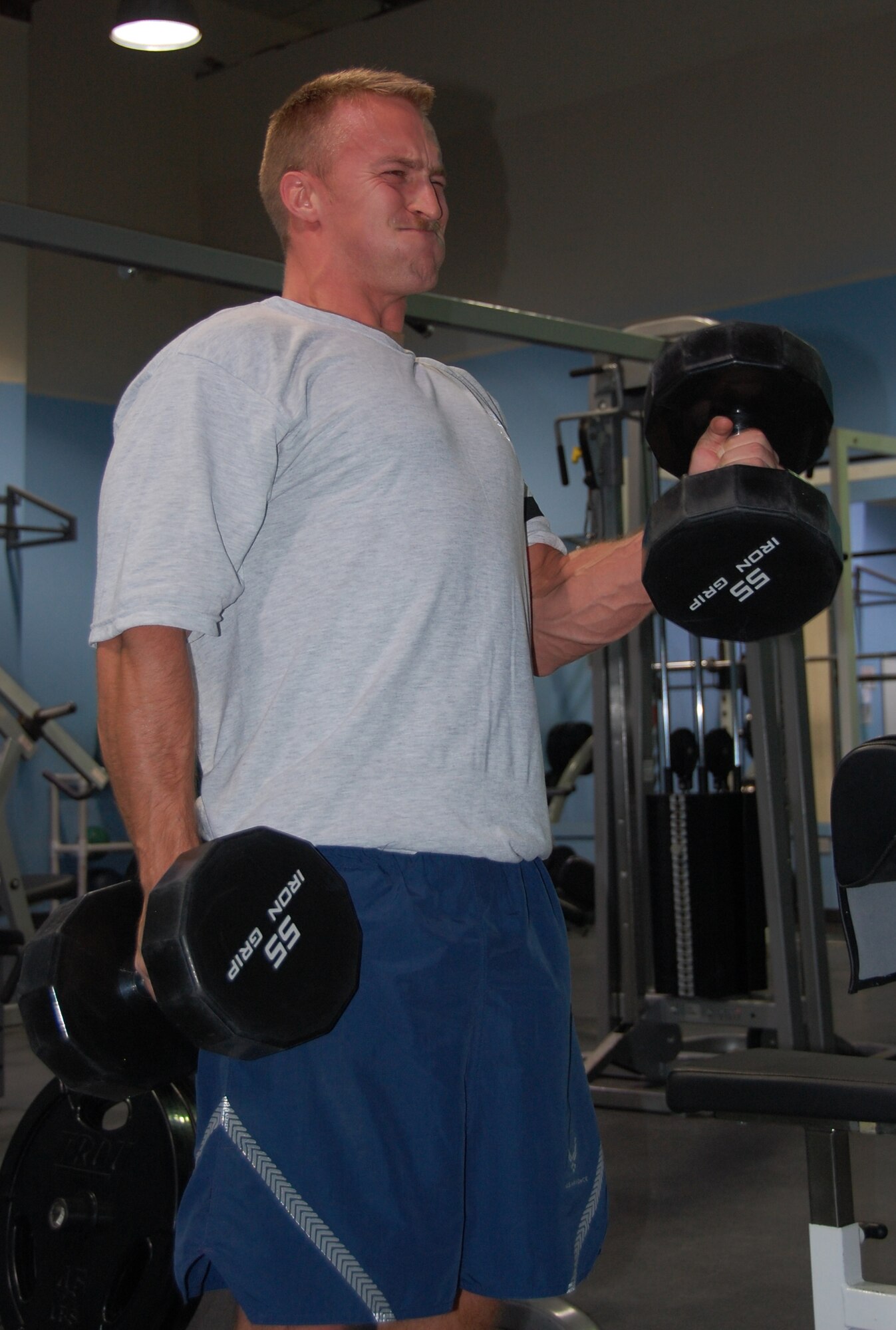 Capt. Alex Lammi, 817th Expeditionary Airlift Squadron, lifts weights in his spare time at the Rock Fitness Center at an air base in Southwest Asia Jan. 1, 2010. (U.S. Air Force photo/Staff Sgt. Lindsey Maurice)