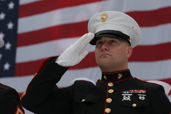 BOSTON -- A Marine from 1st Battalion, 25th Marine Regiment, stands in the snow-covered Fenway Park, as part of a pre-game ceremony before the 2010 Bridgestone NHL Winter Classic, Jan. 1. The Air Force provided a B-2 fly over to culminate the pre-game event.(Official Marine Corps photo by Sgt. Randall A. Clinton) salutes during the National Anthem in the snow-covered Fenway Park, as part of a pre-game ceremony before the 2010 Bridgestone NHL Winter Classic, Jan. 1. The Air Force provided a B-2 fly over to culminate the pre-game event.(Official Marine Corps photo by Sgt. Randall A. Clinton)