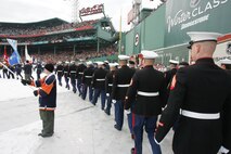 BOSTON -- Marines from 1st Battalion, 25th Marine Regiment, Air Force, Navy, Coast Guard and Army service members stand in formation on Fenway Park for a pre-game ceremony before the 2010 Bridgestone NHL Winter Classic, Jan. 1. The Air Force provided a B-2 fly over to culminate the pre-game event.(Official Marine Corps photo by Sgt. Randall A. Clinton)