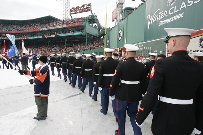 BOSTON -- Marines from 1st Battalion, 25th Marine Regiment, Air Force, Navy, Coast Guard and Army service members stand in formation on Fenway Park for a pre-game ceremony before the 2010 Bridgestone NHL Winter Classic, Jan. 1. The Air Force provided a B-2 fly over to culminate the pre-game event.(Official Marine Corps photo by Sgt. Randall A. Clinton)