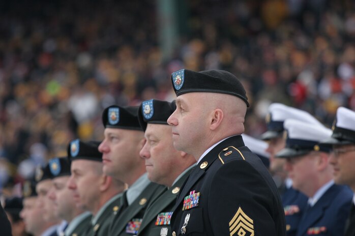 BOSTON -- Marine Corps, Air Force, Navy, Coast Guard and Army service members stand in formation on Fenway Park for a pre-game ceremony before the 2010 Bridgestone NHL Winter Classic, Jan. 1. The Air Force provided a B-2 fly over to culminate the pre-game event.(Official Marine Corps photo by Sgt. Randall A. Clinton)