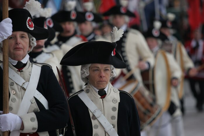 BOSTON -- Period actors march onto Fenway Park as part of a pre-game ceremony before the 2010 Bridgestone NHL Winter Classic, Jan. 1. The event also included, policemen, firemen and military service members carrying the American Flag and their respective unit's colors onto the field. (Official Marine Corps photo by Sgt. Randall A. Clinton)