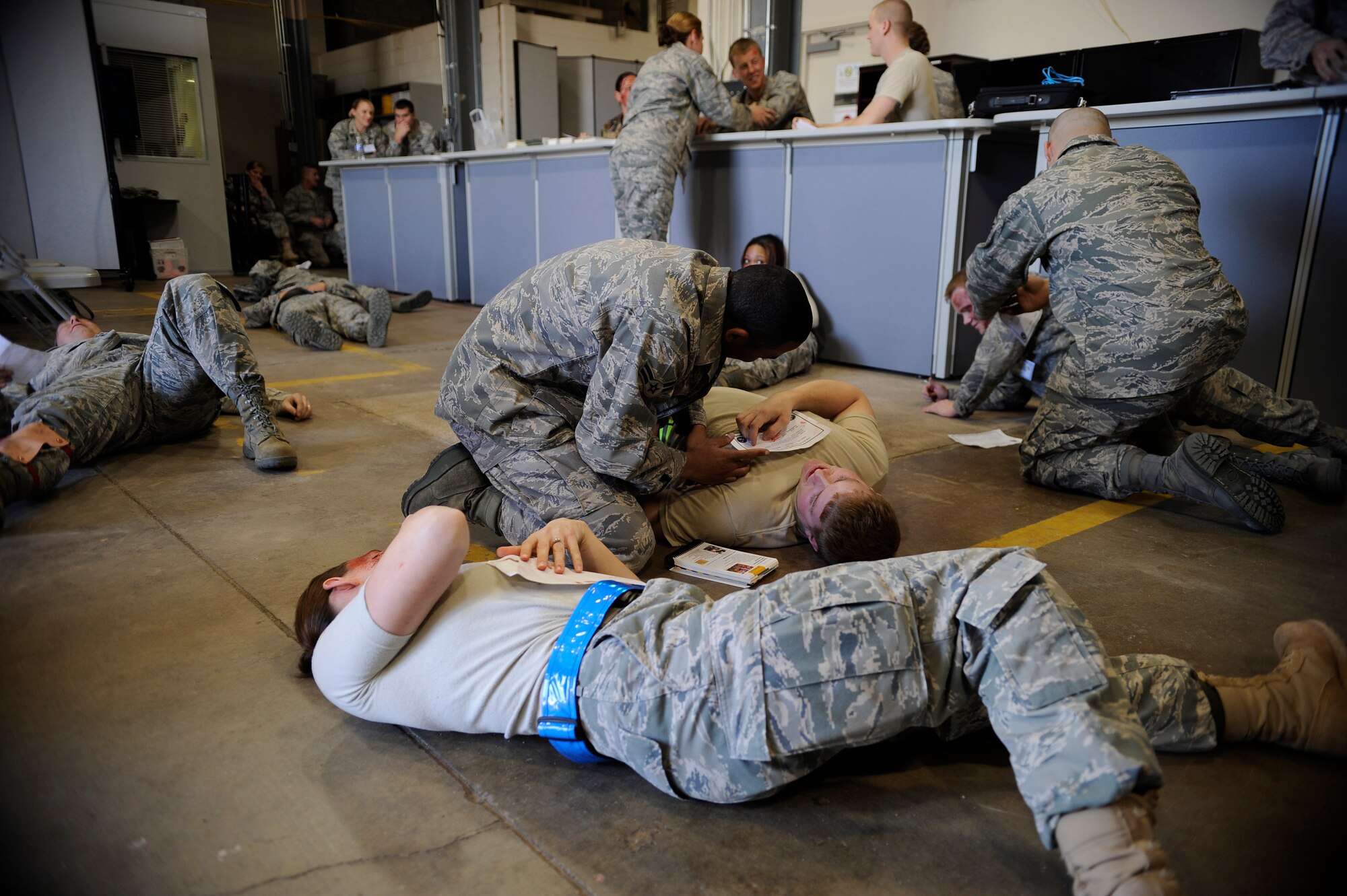 BUCKLEY AIR FORCE BASE, Colo. -- Buckley Air Force Base exercise participants simulate wounds. Col. Crosier asks Airmen to be prepared for exercises during the upcoming ORI. (U.S. Air Force photo)