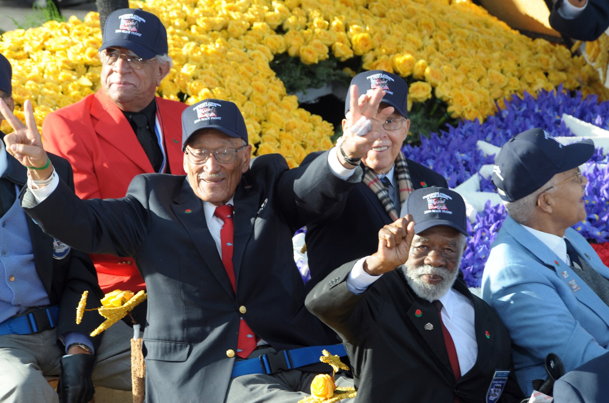 A group of Tuskegee Airmen wave to the crowd from the City of West Covina‘s float during the Tournament of Roses Parade, Jan 1. (Photo by Atiba S. Copeland)