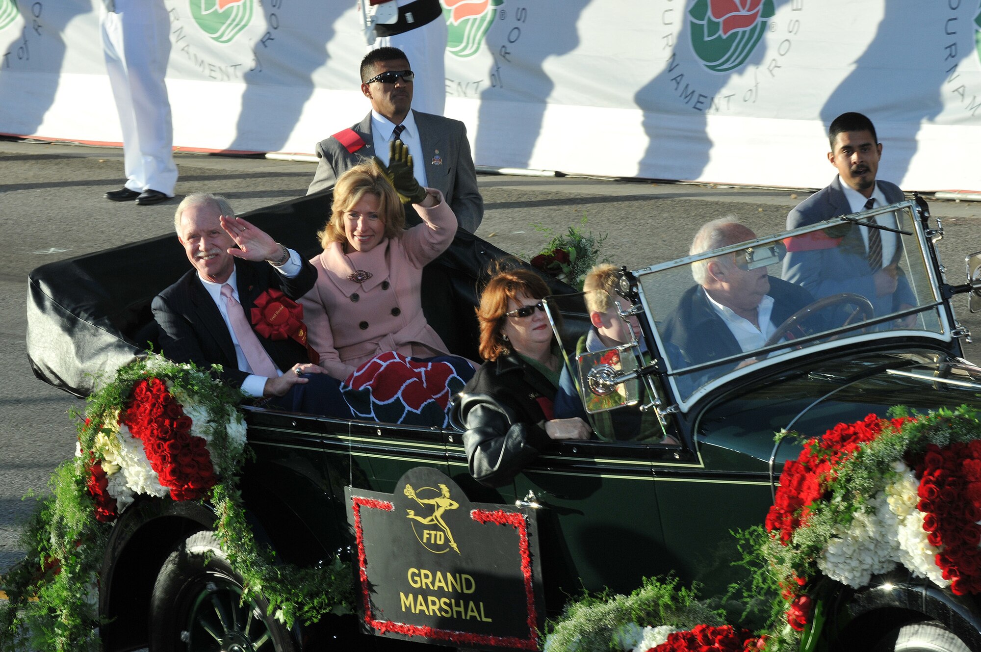 The year’s Grand Marshal Capt. Chesley B. "Sully" Sullenberger waves to the crowd during the Tournament of Rose Parade, Jan 1. The US Airways pilot was honored for saving the lives of everyone aboard an Airbus A320 during an emergency landing on the Hudson River. (Photo by Atiba S. Copeland)