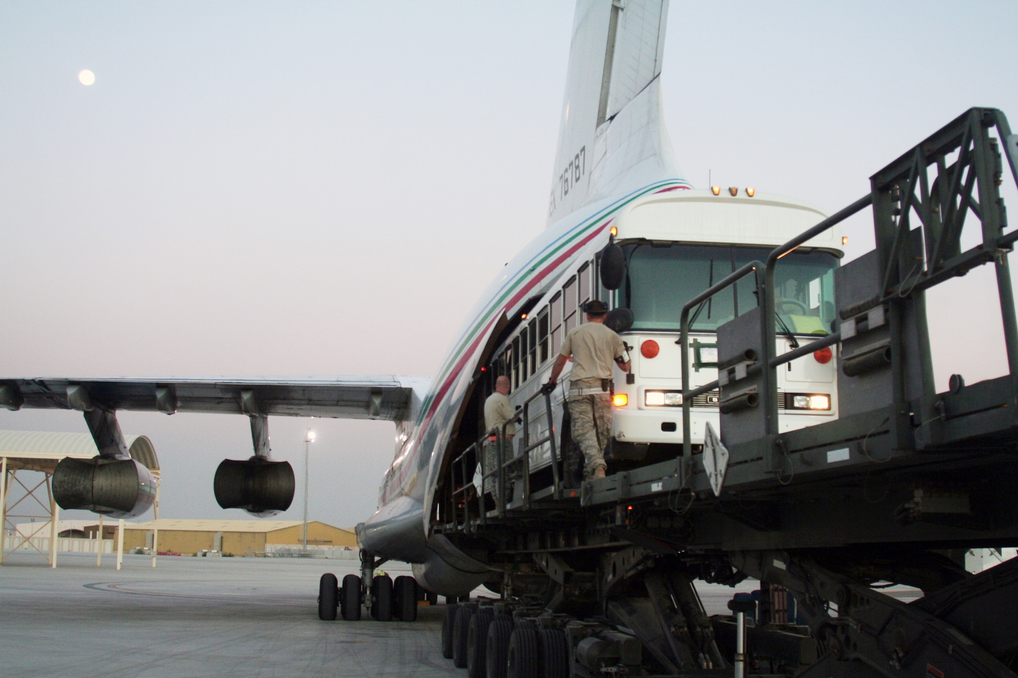 Air transportation Airmen load a 44-passenger bus weighing more than 20,000 pounds onto a Russian-built IL-76 transport plane during operations Dec. 30, 2009, at an air base in Southwest Asia. The bus was one of two that were loaded on the IL-76 for transport to Afghanistan.  The Airmen are assigned to the 380th Expeditionary Logistics Readiness Squadron. (U.S. Air Force photo/Tech. Sgt. Scott T. Sturkol)