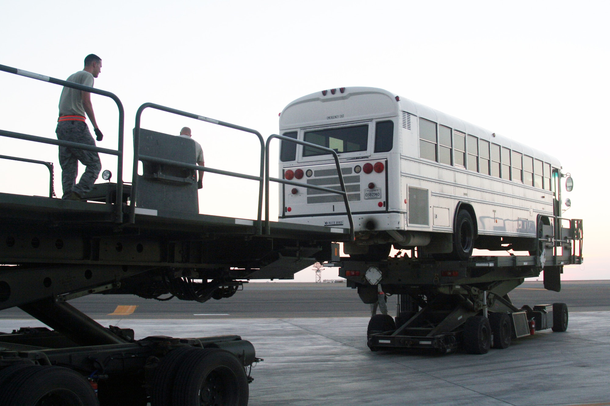 Air transportation Airmen load a 44-passenger bus onto a Russian-built IL-76 transport plane during operations Dec. 30, 2009, at an air base in Southwest Asia. The bus was one of two that were loaded on the IL-76 for transport to Afghanistan. The Airmen are assigned to the 380th Expeditionary Logistics Readiness Squadron. (U.S. Air Force photo/Tech. Sgt. Scott T. Sturkol)