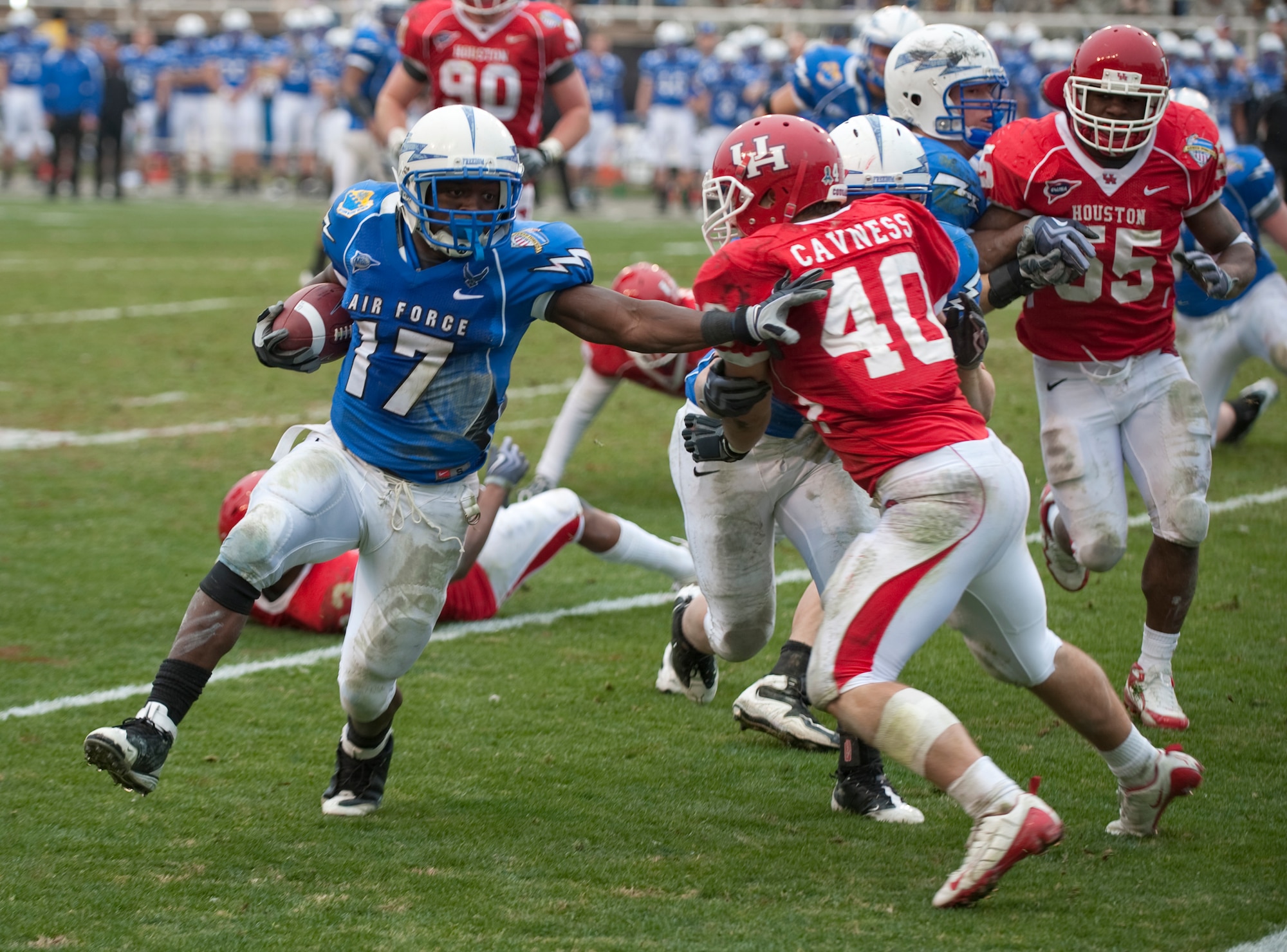 Air Force Academy running back Asher Clark runs for a touchdown during the Falcons' defeat of the University of Houston Cougars 47-20 at the Bell Helicopter Armed Forces Bowl in Fort Worth, Texas, Dec. 31, 2009. (Defense Department photo/Petty Officer 1st Class Chad J. McNeeley)