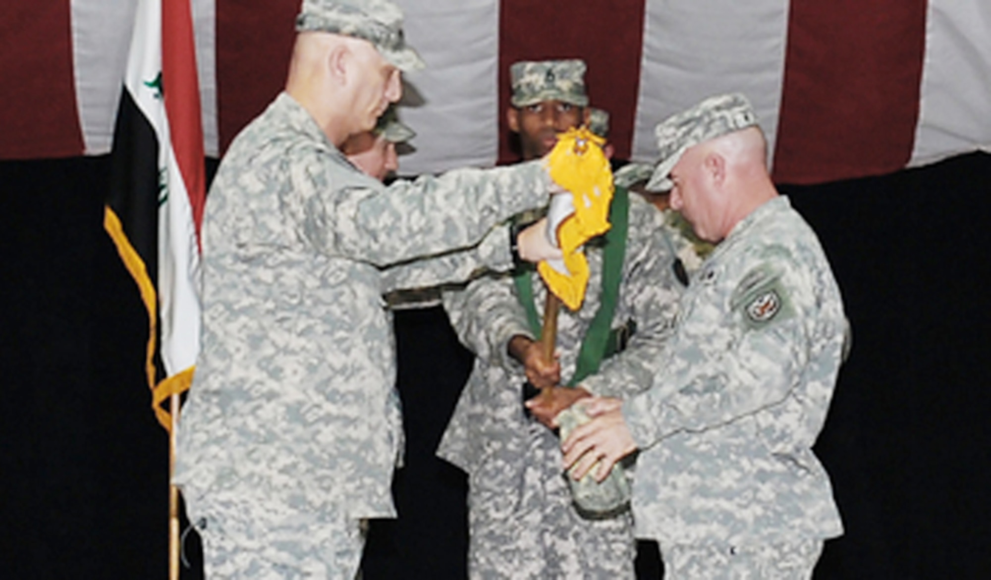 Army Gen. Raymond T. Odierno, U.S. Forces-Iraq commanding general, and Command Sgt. Maj. Lawrence K. Wilson, USF-I command sergeant major, uncase the USF-I colors Jan. 1, 2010, during the activation ceremony at Al Faw Palace, Camp Victory, Iraq. (U.S. Forces-Iraq photo/Michael R Daigle)