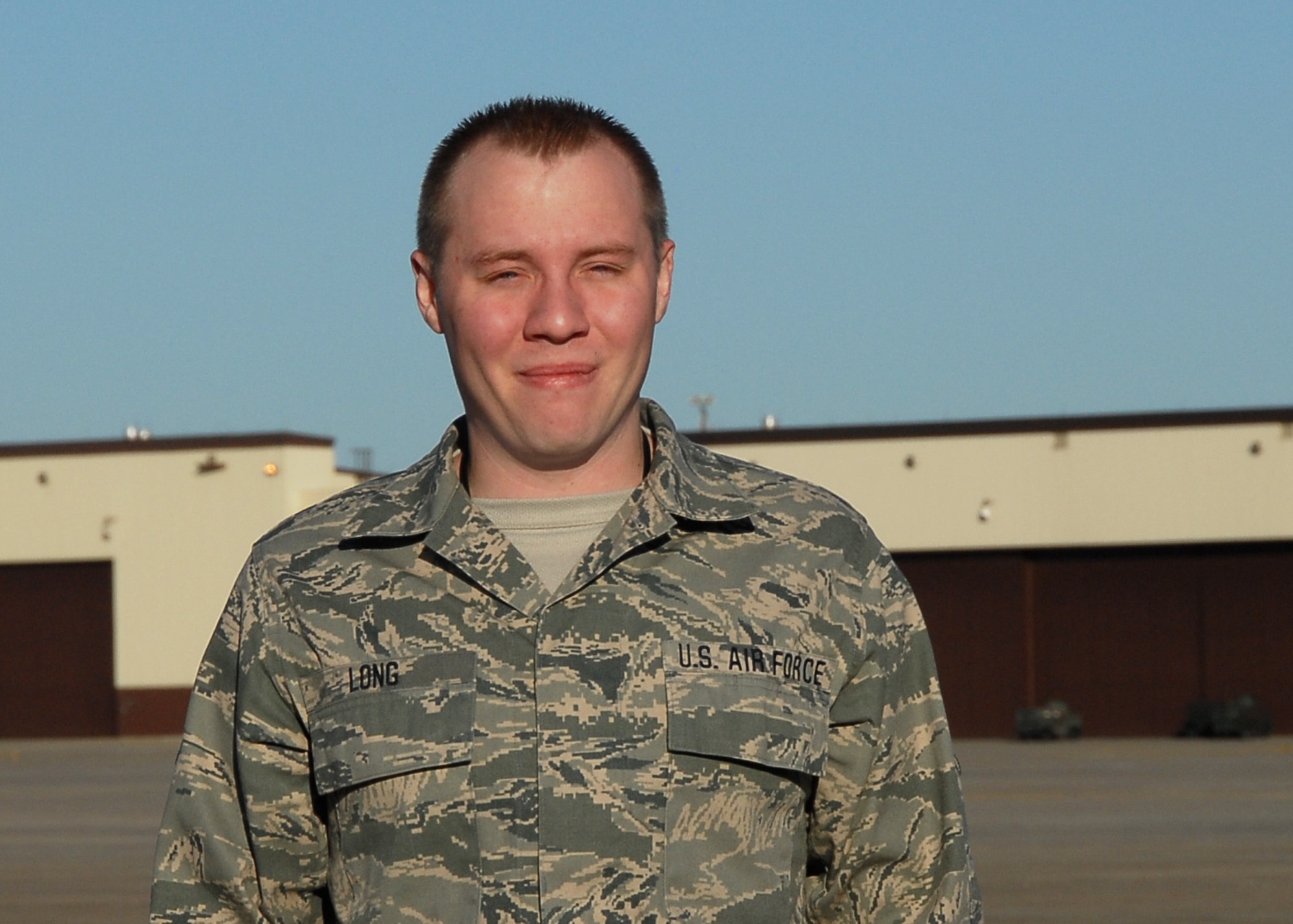 Senior Airman Brandon Long, 131AMXS, Missouri Air National Guard, stands on the flightline at Whiteman Air Force Base, Missouri on Dec 17.  Long was chosen as the 131st Outsanding Airman of the Year-2009  (Air Force Photo by MSgt Mary-Dale Amison   RELEASED)
 