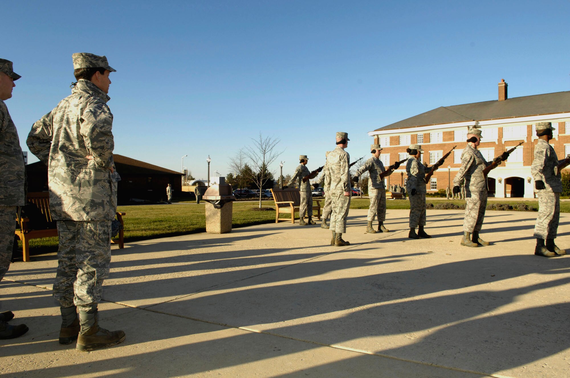 AFDW Commander Maj. Gen. Darrell D. Jones observes a 21-gun salute performed by the United States Air Force Honor Guard Firing Party. Recognized for their roles in state funerals and for conferring honors during military burials, the firing team attempts to sound off in unison and attain the illusion of "Seven as One." The Dec. 16, 2009 immersion tour took General Jones from the 11th Operationsl Group headquarters to the ceremonial lawn and included a tour of all Honor Guard drill facilities at Bolling AFB, Washington, D.C. 