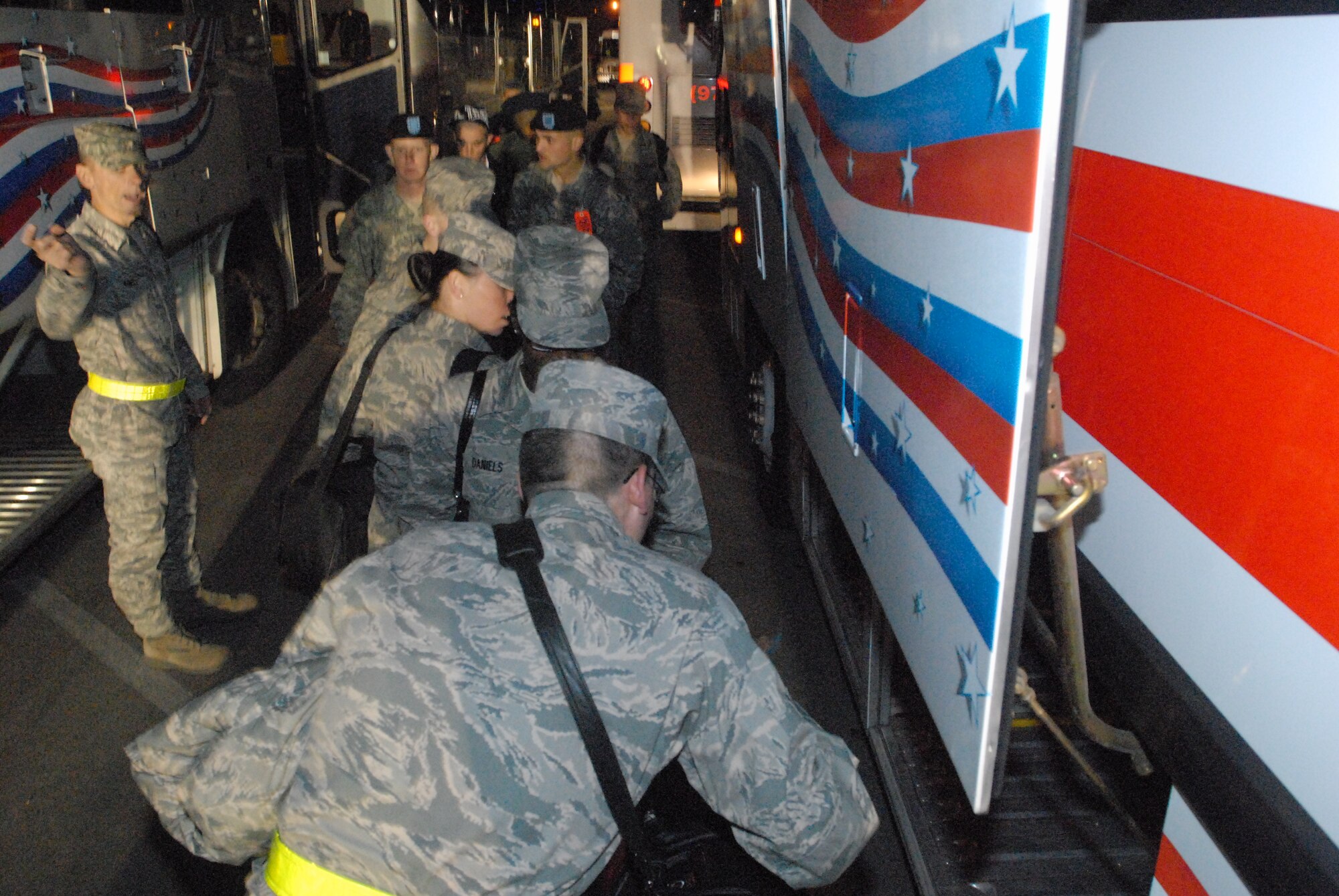 Military personnel assigned to the Goodfellow AFB, Texas for technical training, load their bags and themselves onto buses outside Carswell Field House for rides to area airports prior to going home for the holidays on Dec. 18.  Permanent party personnel assisted over 500 military technical training students in traveling home for the holidays during the event known at Goodfellow as Exodus. (US Air Force photo by Master Sgt. Randy Mallard)