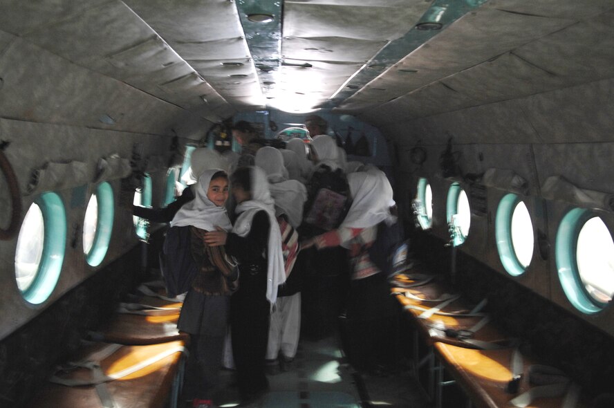 Afghan students tour an Mi-17 helicopter during their visit to the Afghan National Army Air Corps hangar Dec. 31, 2009. (U.S. Air Force photo by Staff Sgt. Angelique N. Smythe/Released) 