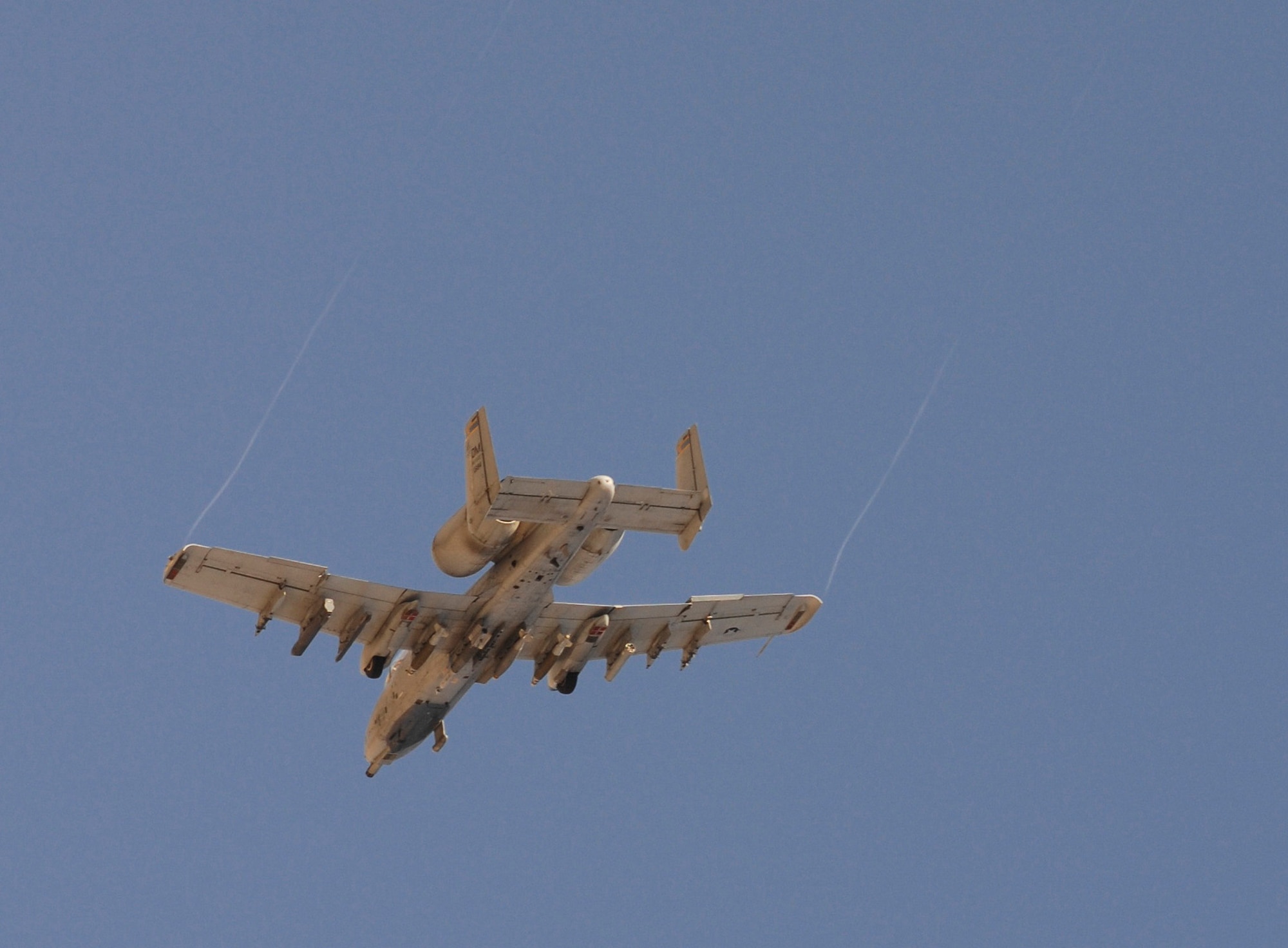 An A-10C Thunderbolt II with the 354th Expeditionary Fighter Squadron flies over Kandahar Airfield, Afghanistan, Jan. 1, 2010, as it completes ten thousand hours of flying during the squadron’s six-month deployment.  (U.S. Air Force photo by Staff Sgt. Dayton Mitchell/Released)