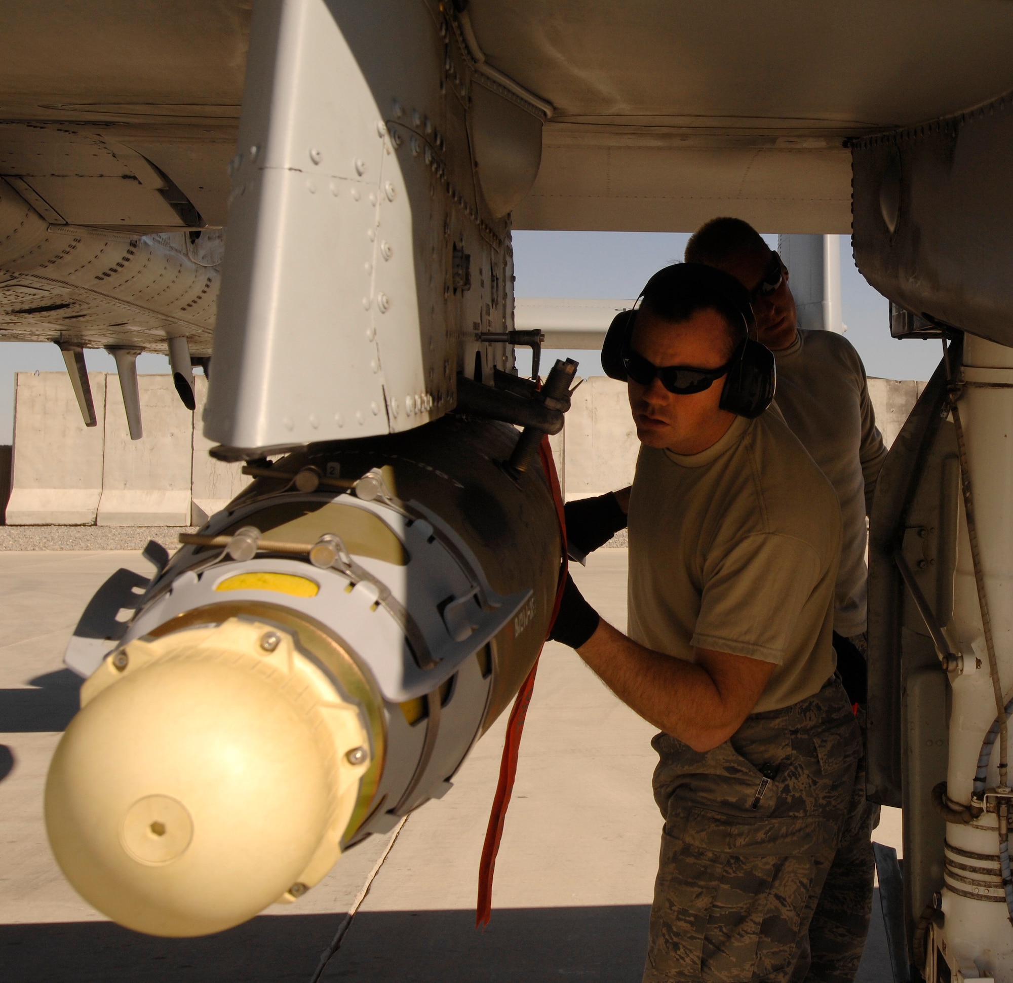A crew chief with 451st Expeditionary Aircraft Maintenance Squadron inspects an A10C Thunderbolt II upon its arrival at Kandahar Airfield, Afghanistan, Jan. 1, 2010. (U.S. Air Force photo by Staff Sgt. Dayton Mitchell/Released)