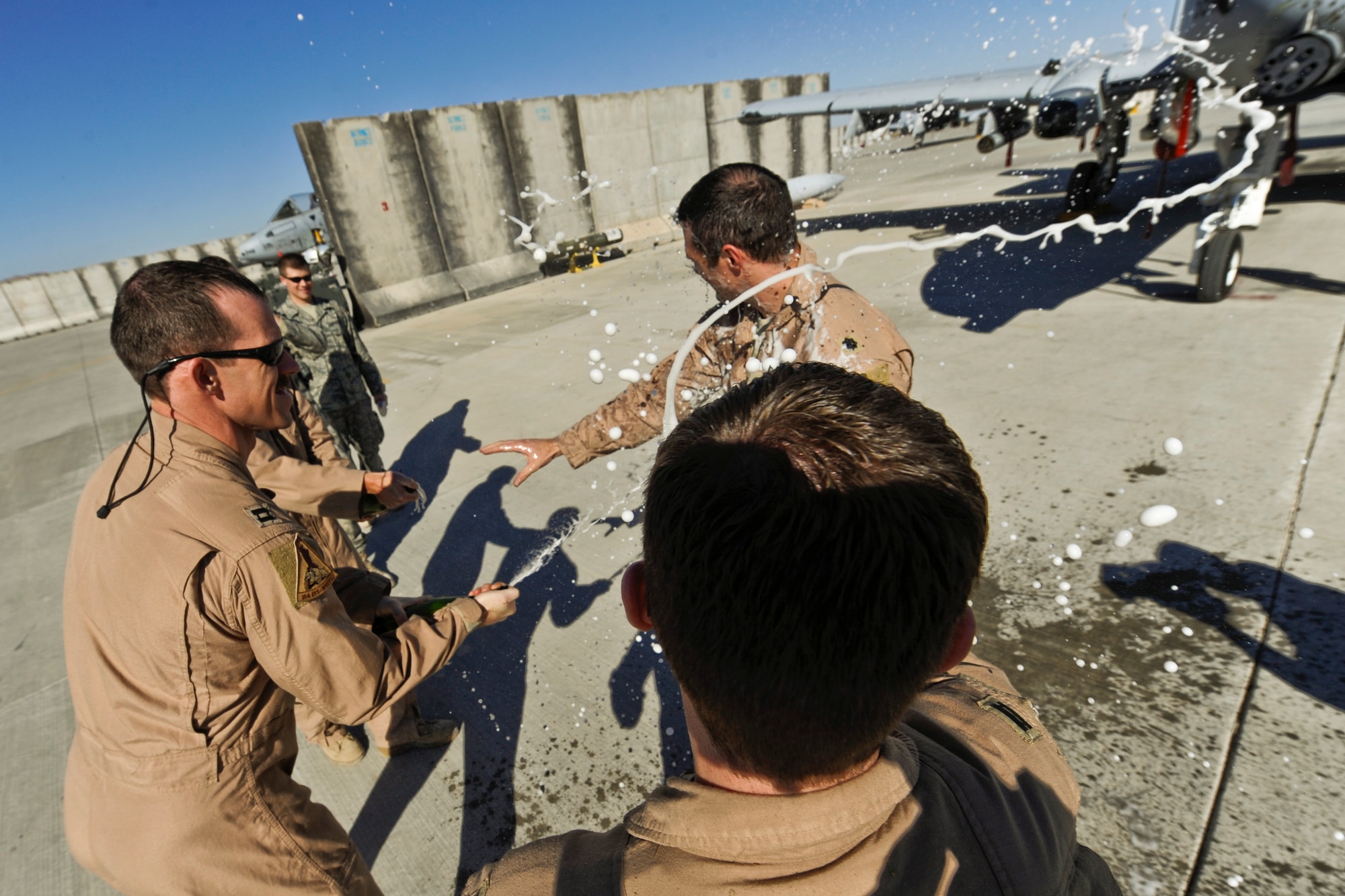 U.S. Air Force Lt. Col. Michael Millen, an A-10C Thunderbolt II pilot with the 354th Expeditionary Fighter Squadron, celebrates  the completion of  ten thousand hours of flying, during the squadron’s six-month deployment, Kandahar Airfield, Afghanistan, Jan. 1, 2010. (U.S. Air Force photo by Tech. Sgt. Efren Lopez/Released)