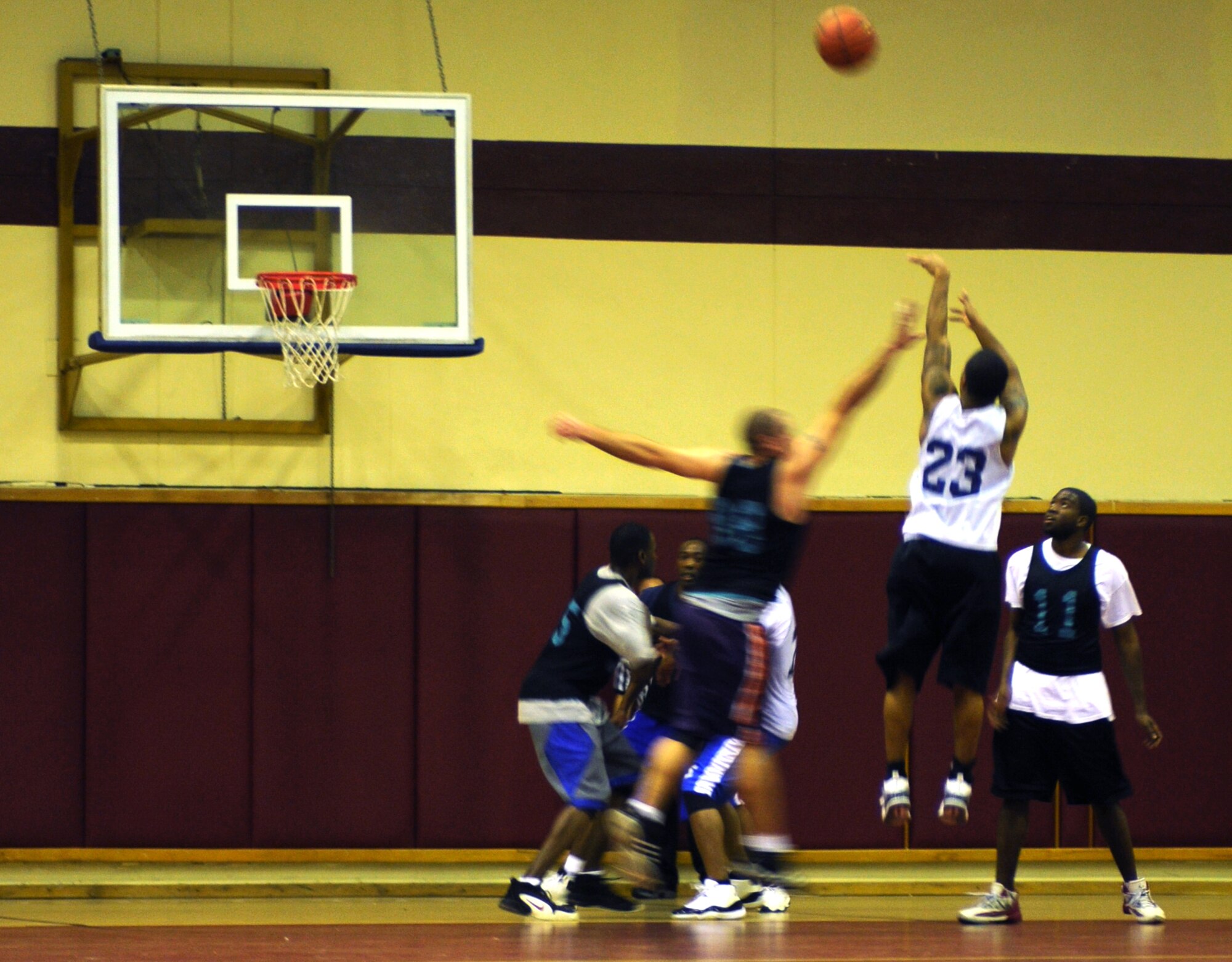 Airmen from the 39th Comptroller and Contracting Squadrons’ team challenge Airmen from the Men’s Varsity Team during an intramural basketball game Monday, Dec. 21, 2009, at Incirlik’s Fitness Center. The CPTS/CONS dominated the Men's Varsity Team, beating them 56 - 32. (U.S. Air Force photo/Senior Airman Sara Csurilla)