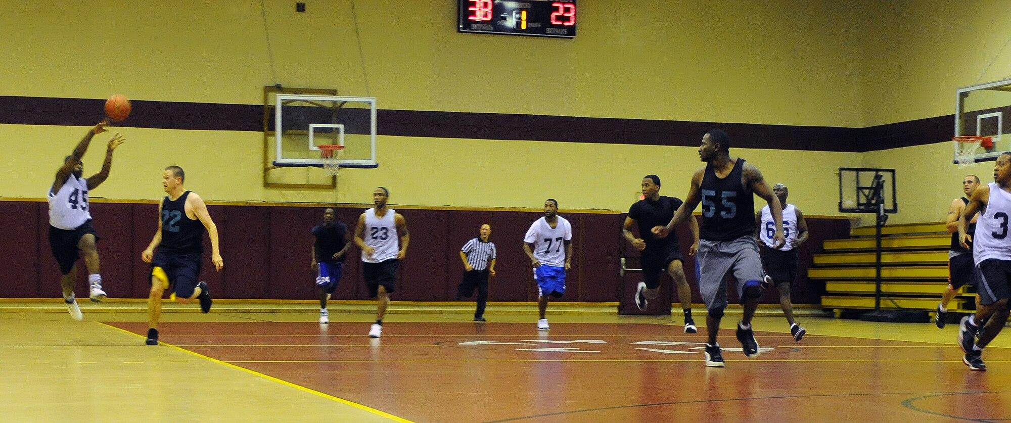 Airmen from the 39th Comptroller and Contracting Squadrons’ team challenge Airmen from the Men’s Varsity Team during an intramural basketball game Monday, Dec. 21, 2009, at Incirlik’s Fitness Center. The CPTS/CONS dominated the Men's Varsity Team, beating them 56 - 32. (U.S. Air Force photo/Senior Airman Sara Csurilla)