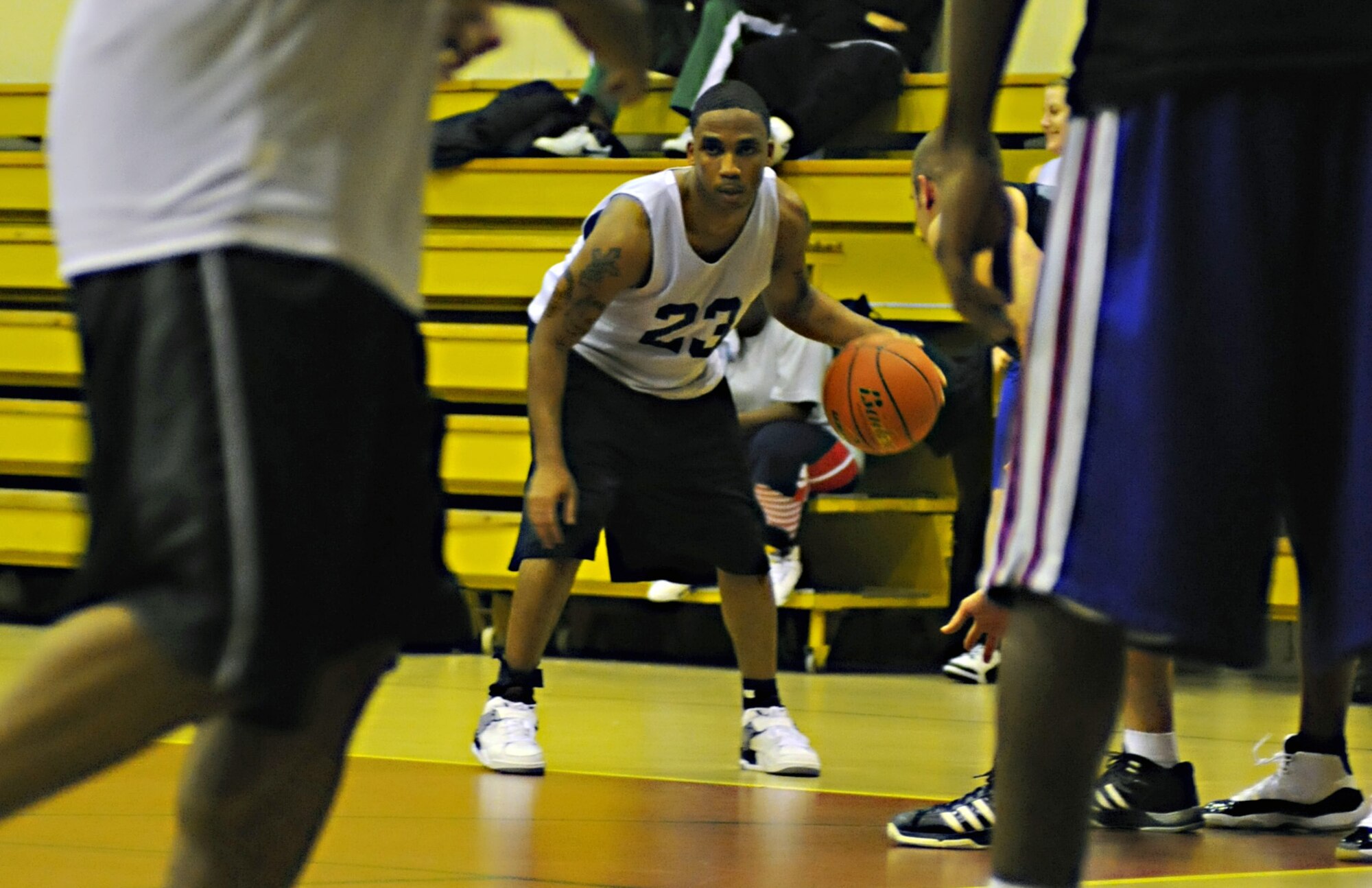 A member of the 39th Men’s Varsity basketball team focuses before taking a shot against the 39th Comptroller and Contracting Squadrons’ team during an intramural basketball game Monday, Dec. 21, 2009, at Incirlik’s Fitness Center. The CPTS/CONS dominated the Men's Varsity Team, beating them 56 - 32. (U.S. Air Force photo/Senior Airman Sara Csurilla)