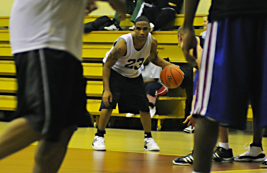 A member of the 39th Men’s Varsity basketball team focuses before taking a shot against the 39th Comptroller and Contracting Squadrons’ team during an intramural basketball game Monday, Dec. 21, 2009, at Incirlik’s Fitness Center. The Men's Varsity Team dominated the CPTS/CONS, beating them 56 - 32. (U.S. Air Force photo/Senior Airman Sara Csurilla) 