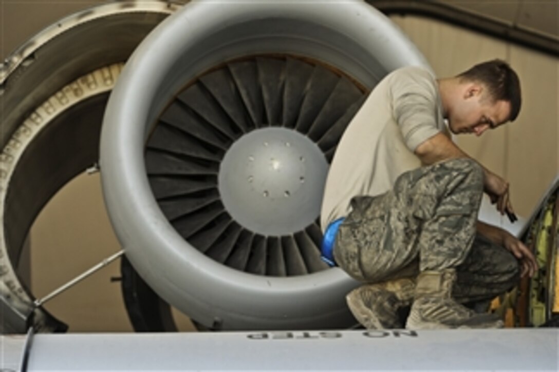 U.S. Air Force Airman 1st Class L.B. Arnold, with the 451st Expeditionary Maintenance Squadron, inspects an A-10C Thunderbolt aircraft at Kandahar Airfield, Afghanistan, on Dec. 27, 2009.  