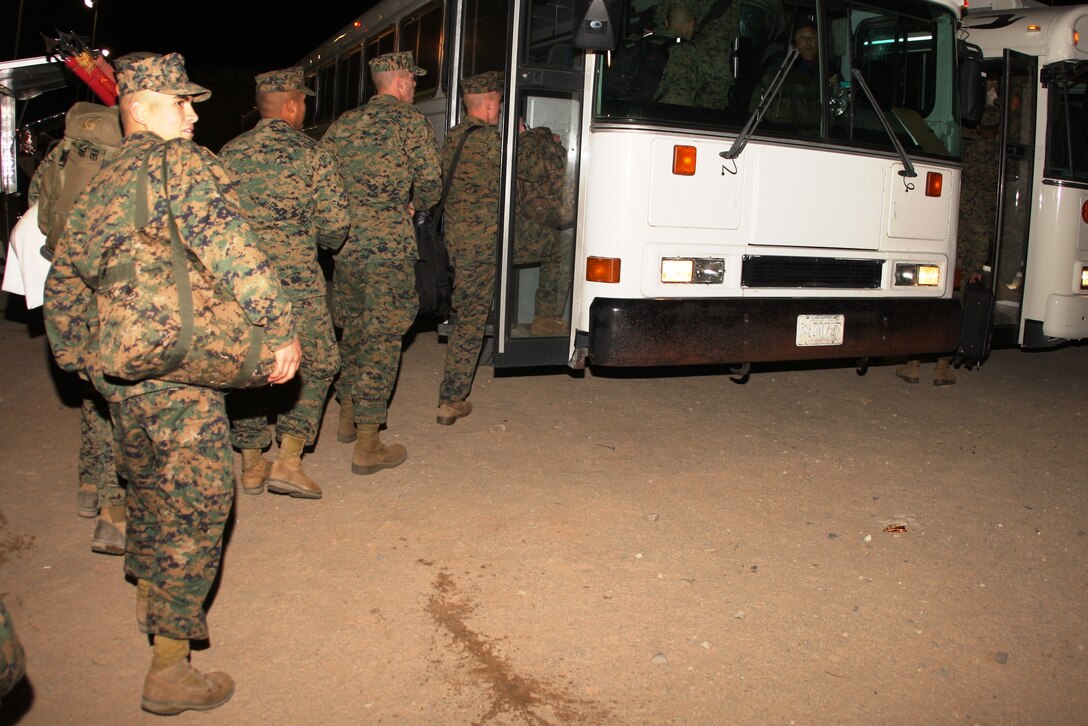 Marines and sailors with 2nd Battalion, 7th Marine Regiment, load onto buses Wednesday to catch a flight overseas to join the 31st Marine Expeditionary Unit in Japan. The battalion is the first in the regiment to deploy with any MEU as a ground combat element.
