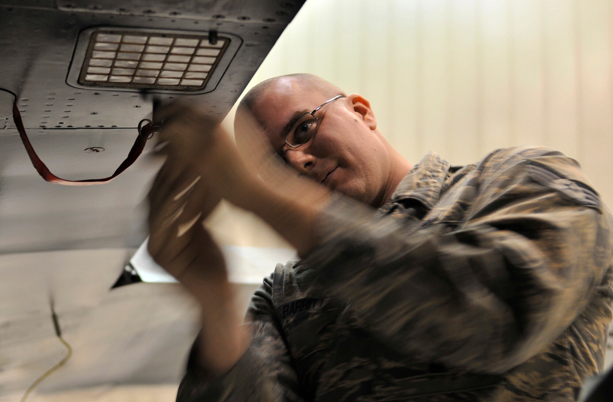 Staff Sgt. Kraig Barritt secures flares on to an F-16 Fighting Falcon during the weapons load crew of the year competition Dec. 17, 2009, Eielson Air Force Base, Alaska. Sergeant Barritt is a weapons load team chief assigned to the 354th Aircraft Maintenance Squadron. (U.S. Air Force photo/Staff Sgt. Christopher Boitz)