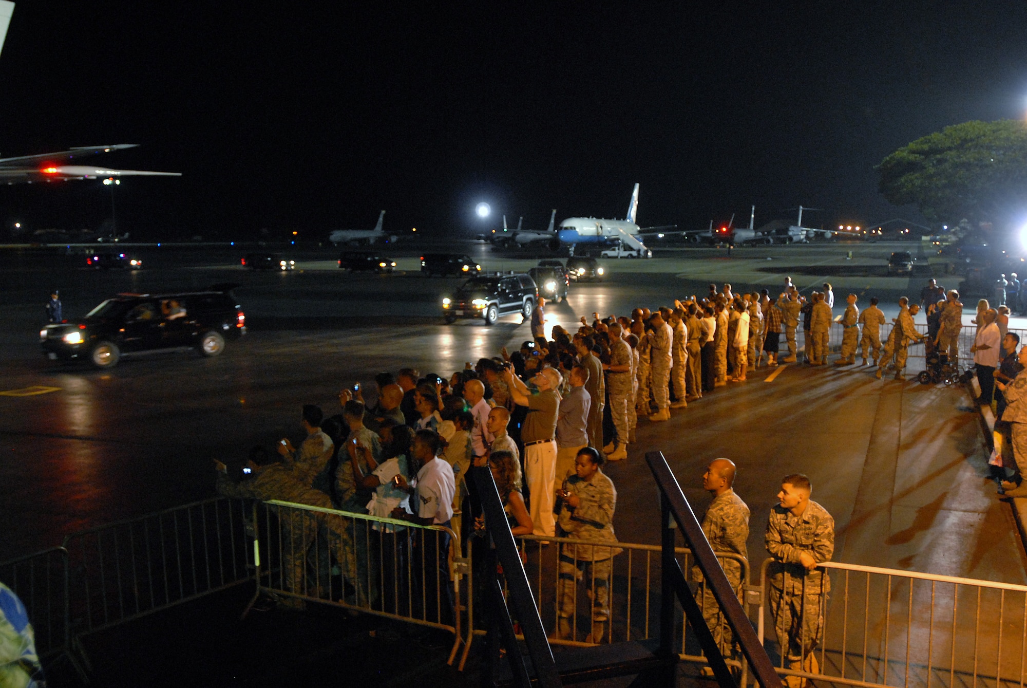 HICKAM AIR FORCE BASE, Hawaii ? Local media and Hickam Airmen gather for the departure of President Obama and the First Family on-board Air Force One at 10:00 p.m. on Jan. 3. The Obama?s spent 11 days vacationing throughout the island of O?ahu. (U.S. Air Force photo/Master Sgt. Jeffry Allen)   