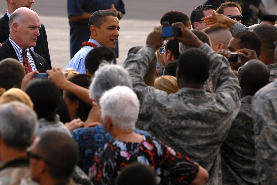 HICKAM AIR FORCE BASE, Hawaii - President Obama greets airmen during his arrival here, Dec. 24. The Obama?s spent 11 days vacationing throughout the island of O?ahu. (U.S. Air Force photo/Master Sgt. Jeffrey Allen)