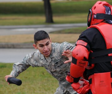 Airman 1st Class George Cervantes, 12th Security Forces Squadron, attempts to hit Maj. Frank Hellstern, 12th SFS commander, during baton training.  Baton training teaches security forces Airmen how to engage an opponent using non-deadly force.(U.S. Air Force photo/Don Lindsey)
