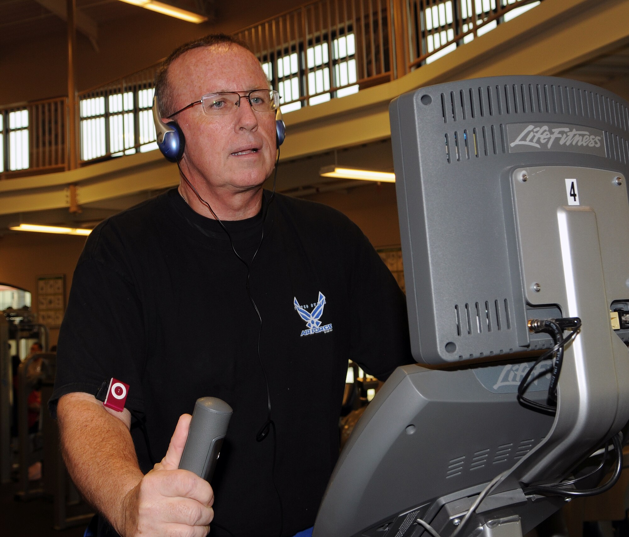Mike Porter, 12th Force Support Squadron assistant lodging manager, tackles the  stair step at the Rambler Fitness Center recently after receiving bariatric surgery in 2009.  Mr. Porter has integrated healthy eating, weightlifting and running into his normal routine to maintain a healthy lifestyle. (Photo by Don Lindsey)