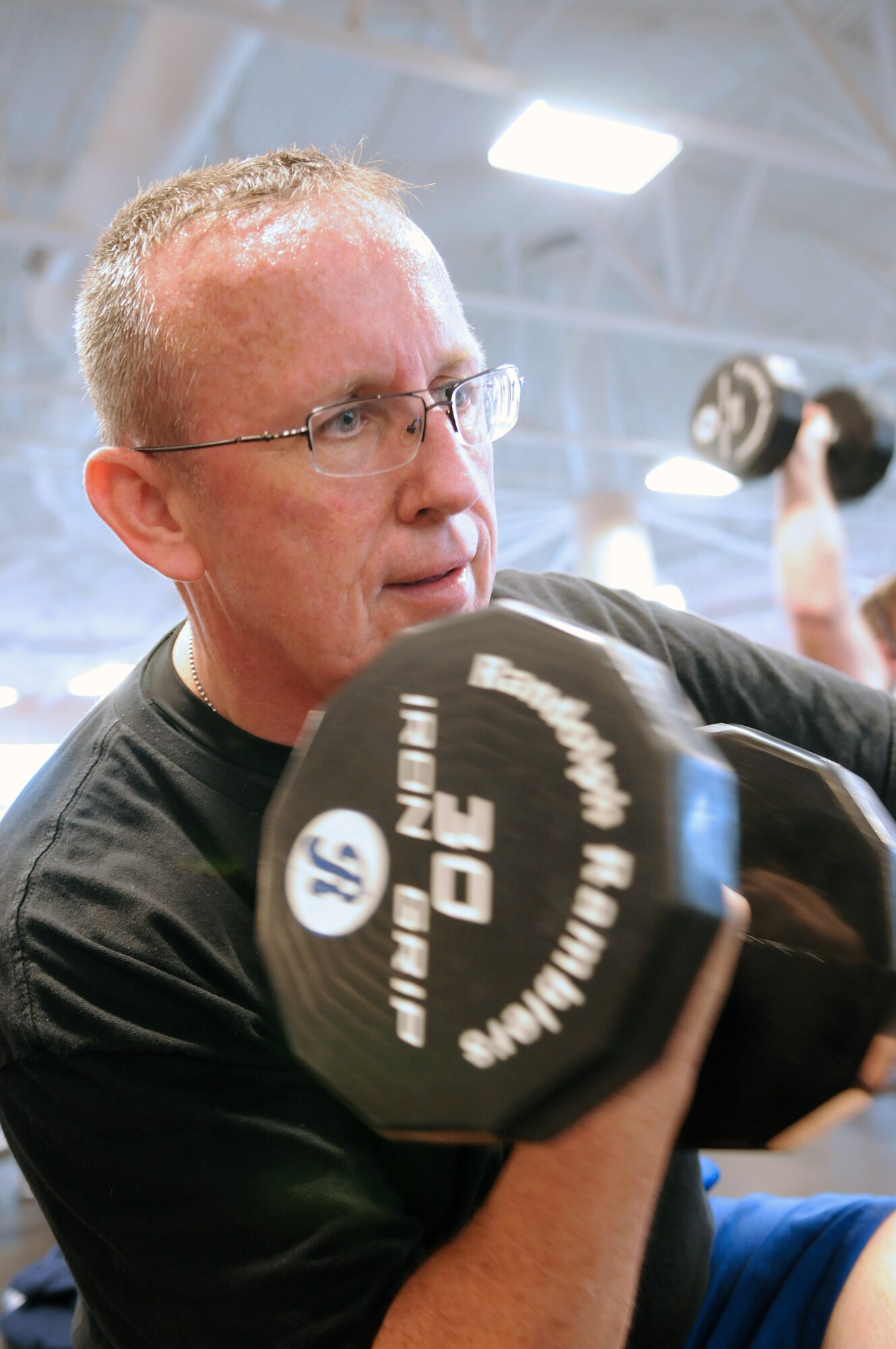 Mike Porter, 12th Force Support Squadron assistant lodging manager, lifts weights at the Rambler Fitness Center recently.Mr. Porter has gone from a 46 to a 34-inch waist after receiving bariatric surgery in 2009 and incoorporating healthy eating habits, running and weightlifting into his everyday routine.  (Photo by Don Lindsey)