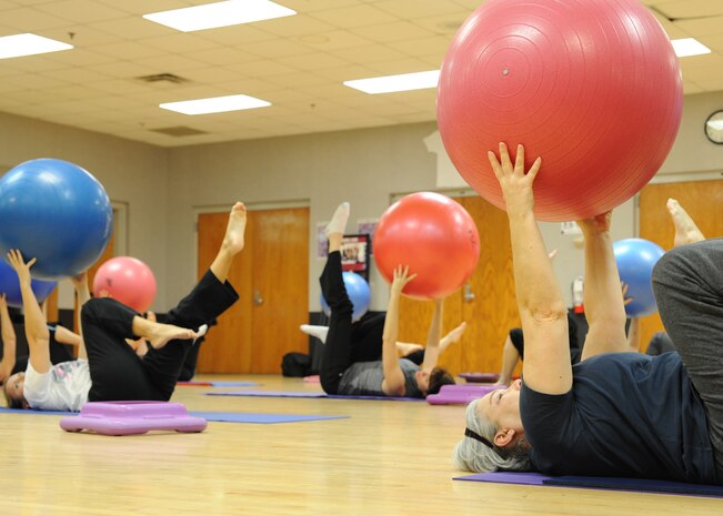 Core Fusion class members perform a core muscle strength routine at the Fitness and Sports Center here Jan. 4. The Core Fusion class is led by a certified personal trainer who has held the class for more than one year. Classes are held twice a week lasting one hour and one express class is held lasting 40 minutes. (U.S. Air Force photo/Senior Airman Katie Gieratz)(RELEASED)