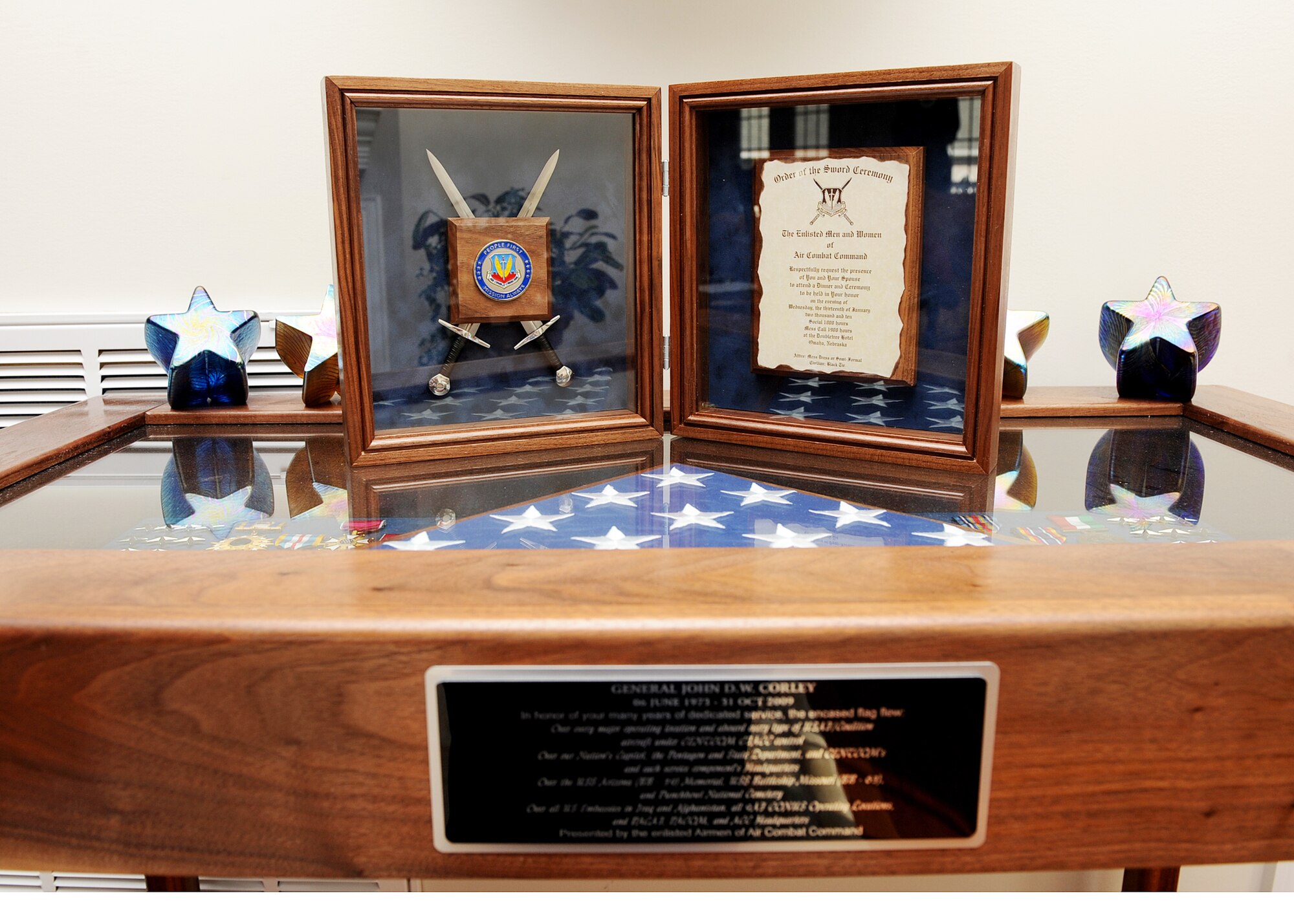 Retired Gen. John D. W. Corley displays his Order of the Sword induction ceremony invitation atop a shadow box he received during his retirement ceremony in September. The Order of the Sword induction ceremony, which is the highest honor enlisted men and women can bestow upon an officer, is set for Jan. 13 in Omaha, Neb. General Corley is the former commander of Air Combat Command. (U.S. Air Force photo/Airman Rebecca Montez)