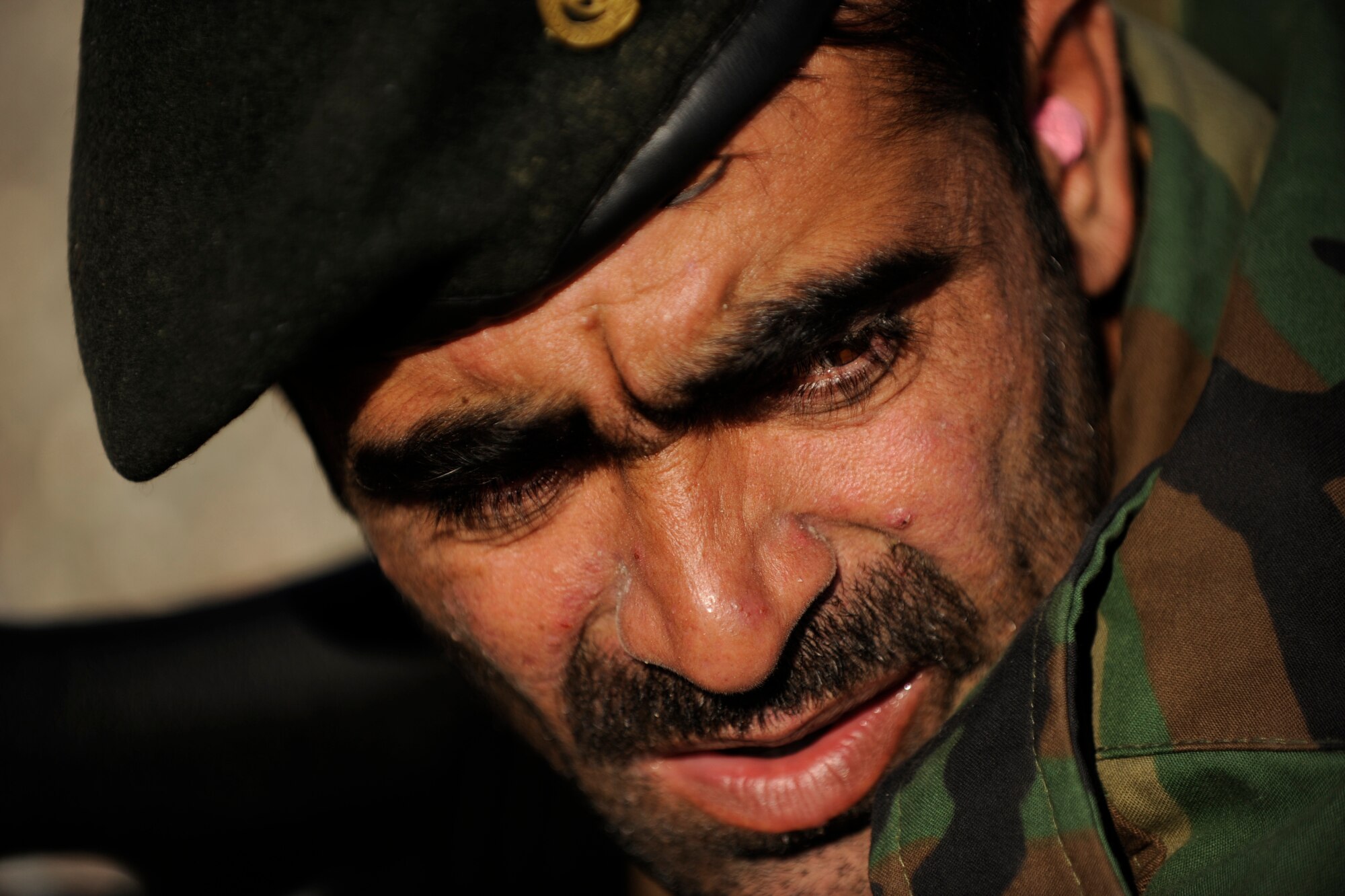 An Afghanistan National Army Air Corps soldier waits for the command to fire during weapons familiarization training in Kandahar, Afghanistan, Jan. 4, 2010. Airmen from the 738th Air Expeditionary Advisory Group mentor Afghan soldiers as they work to take over their own security. (U.S. Air Force photo/Staff Sgt. Manuel J. Martinez/Released)