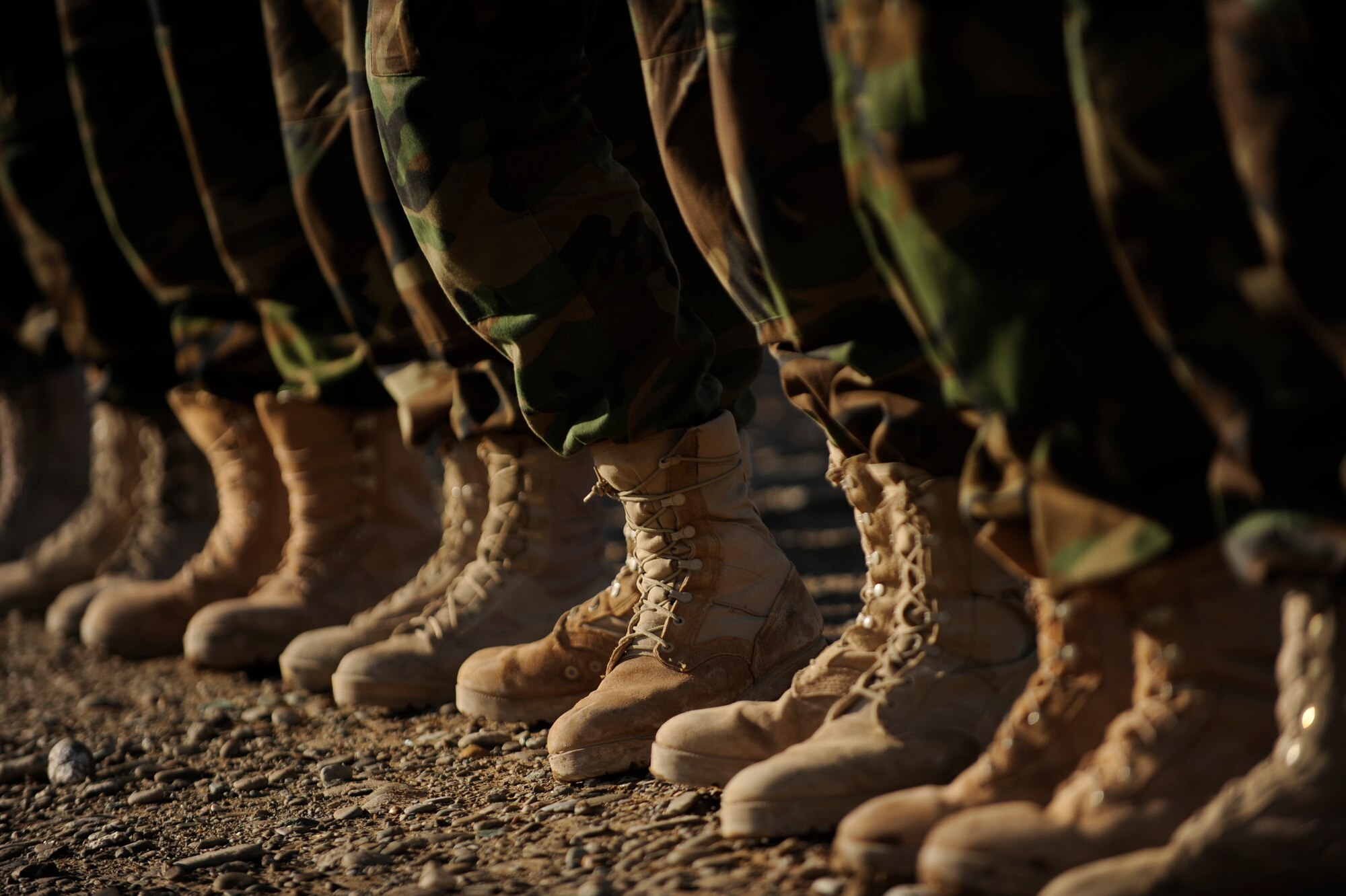 Afghanistan National Army Air Corps soldiers get ready to fill the boots of U.S. Forces as they prepare for M-240B machine gun familiarization training in Kandahar, Afghanistan, Jan. 4, 2010. The Afghan soldiers are training with 738th Air Expeditionary Advisory Group Airmen to gain the skills needed to fulfill security requirements independently.  (U.S. Air Force photo/Staff Sgt. Manuel J. Martinez/Released)
