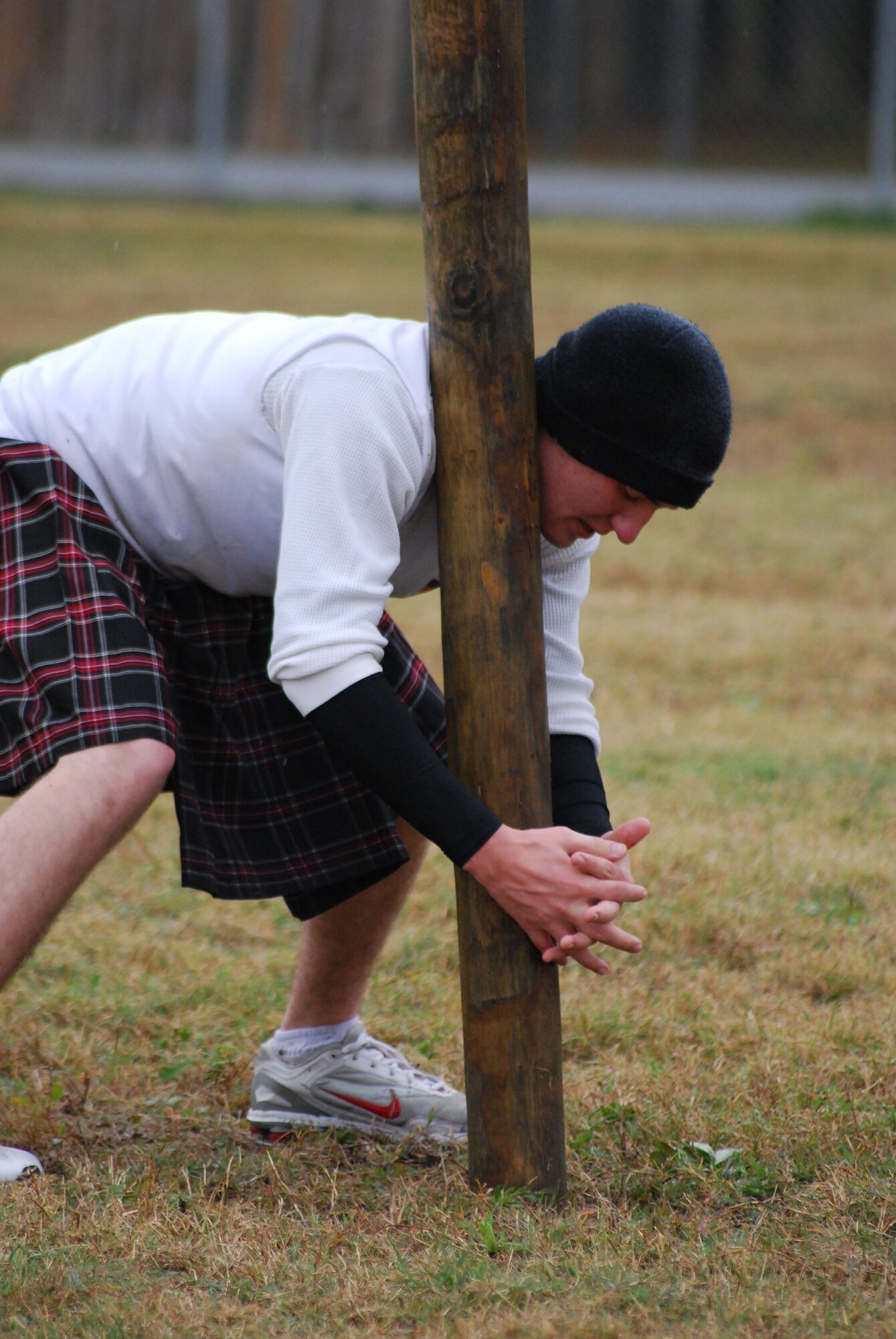 MOODY AIR FORCE BASE, Ga. -- A participant of the Scottish Highland Games cradles a log against his shoulder before tossing it here Dec. 12. The games are a test of strength, endurance and body control. (U.S. Air Force photo by Senior Airman Calinn Weber)