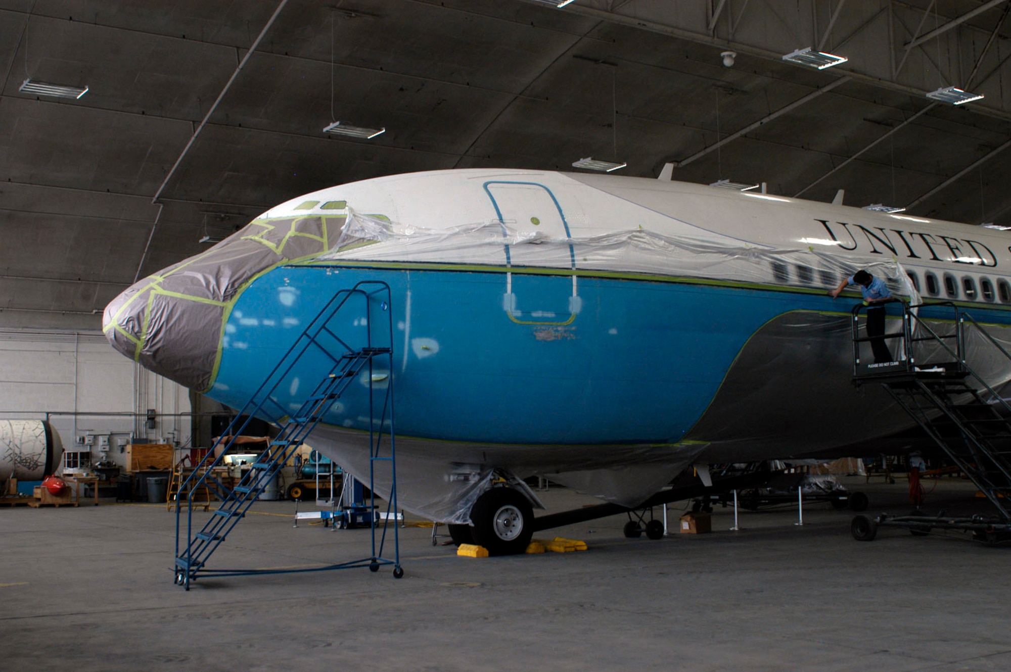 DAYTON, Ohio - Restoration specialists prepare SAM 26000 for painting in the restoration hangar at the National Museum of the U.S. Air Force. (U.S. Air Force photo)