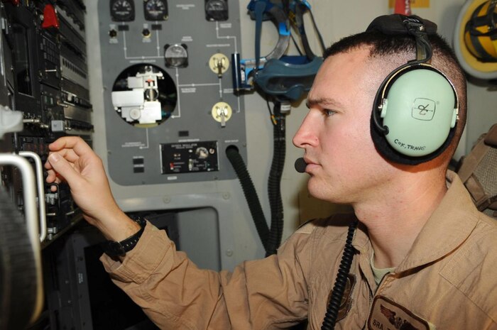 U.S. Air Force Senior Airman Travis Cox runs a preflight check Jan. 1 in the forward loadmaster seat of a deployed C-17. The C-17 is capable of rapid strategic delivery of troops and all types of cargo to main operating bases or directly to forward bases in deployed combat areas. Airman Cox is a loadmaster deployed from Charleston Air Force Base, S.C., and is assigned to the 816th Expeditionary Airlift Squadron. (U.S. Air Force photo/Senior Airman Kasey Zickmund)