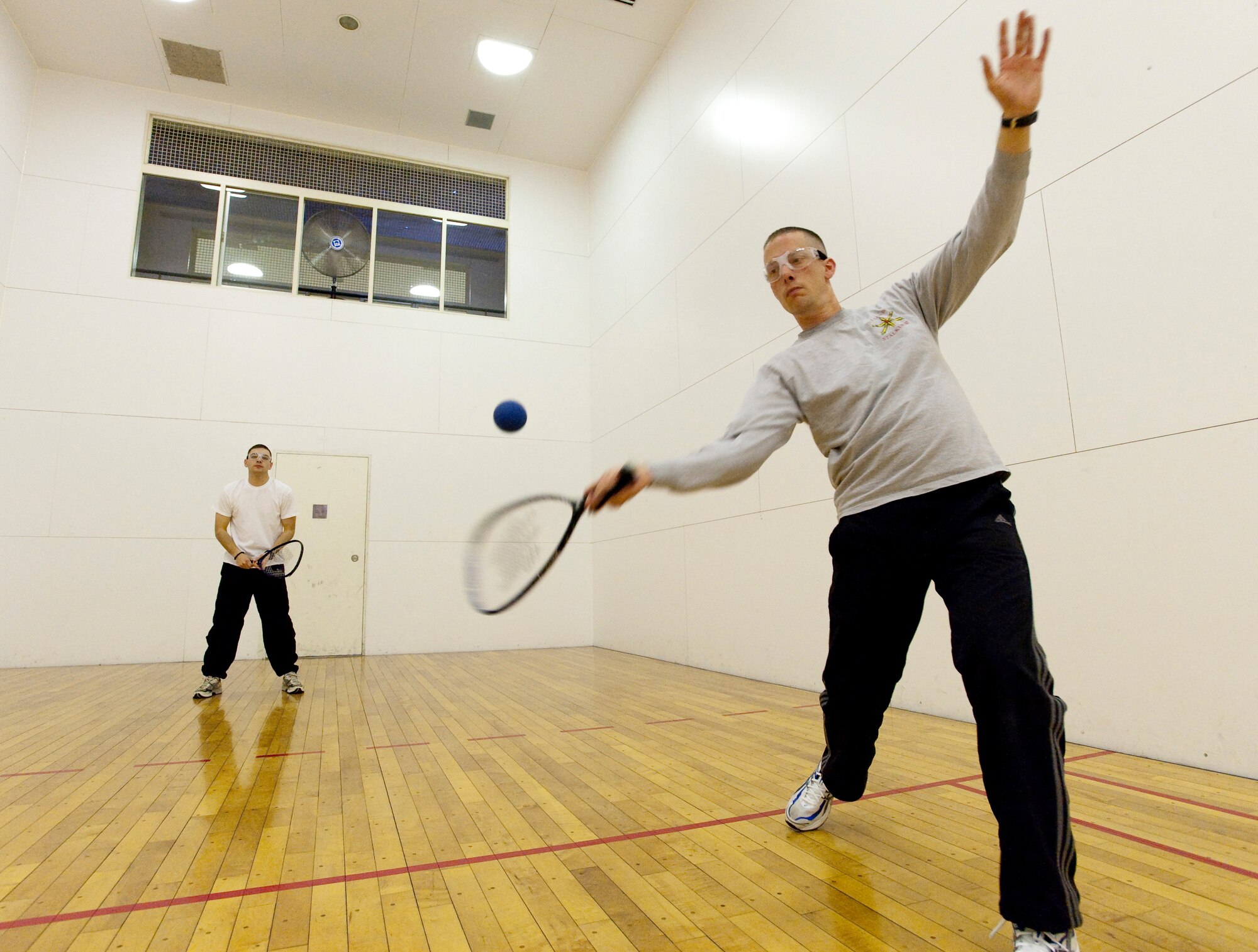 MISAWA AIR BASE, Japan -- Army Staff Sgts. Christopher Douglas and Terrence Jewell, Joint Tactical Ground Station early missile warning operators, play racquetball in the Potter Fitness Center Jan. 7. The 35th Force Support Squadron offers many options for the Misawa community to stay active, which includes aerobics classes, ski and snowboarding trips and facilities for playing a variety of sports. (U.S. Air Force photo/Staff Sgt. Samuel Morse)