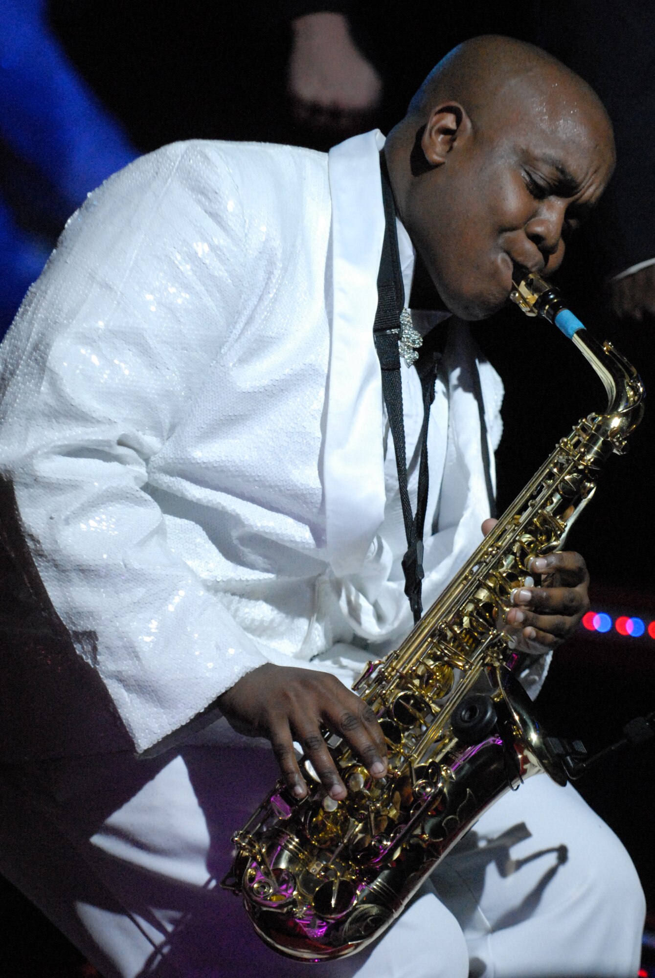 HICKAM AIR FORCE BASE, Hawaii - Senior Airman Tigh Lewis plays the saxophone during a Tops In Blue Performance here, Jan. 5. Tops In Blue is an expeditionary entertainment unit that primarly performs for those stationed worldwide at remote and deployed locations. (U.S. Air Force photo/Senior Airman Gustavo Gonzalez)