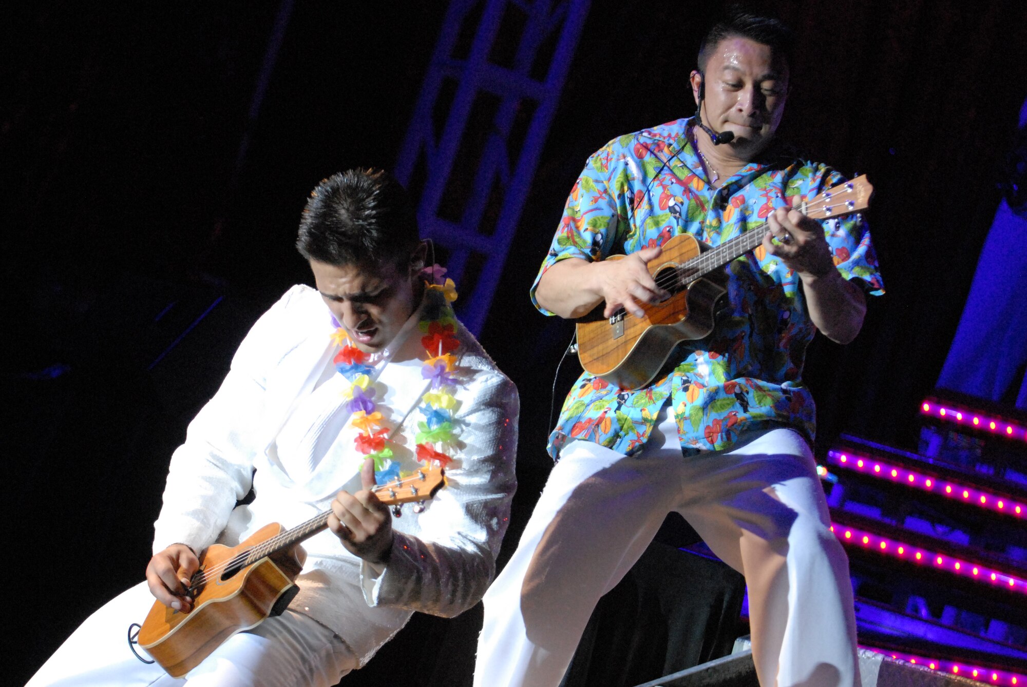 HICKAM AIR FORCE BASE, Hawaii - Airman 1st Class Shane Jones and Master Sgt. Herbert Ancog, Tops In Blue, play the ukelele during a Tops In Blue performance here, Jan. 5. Tops In Blue is an expeditionary entertainment unit that primarly performs for those stationed worldwide at remote and deployed locations. (U.S. Air Force photo/Senior Airman Gustavo Gonzalez)