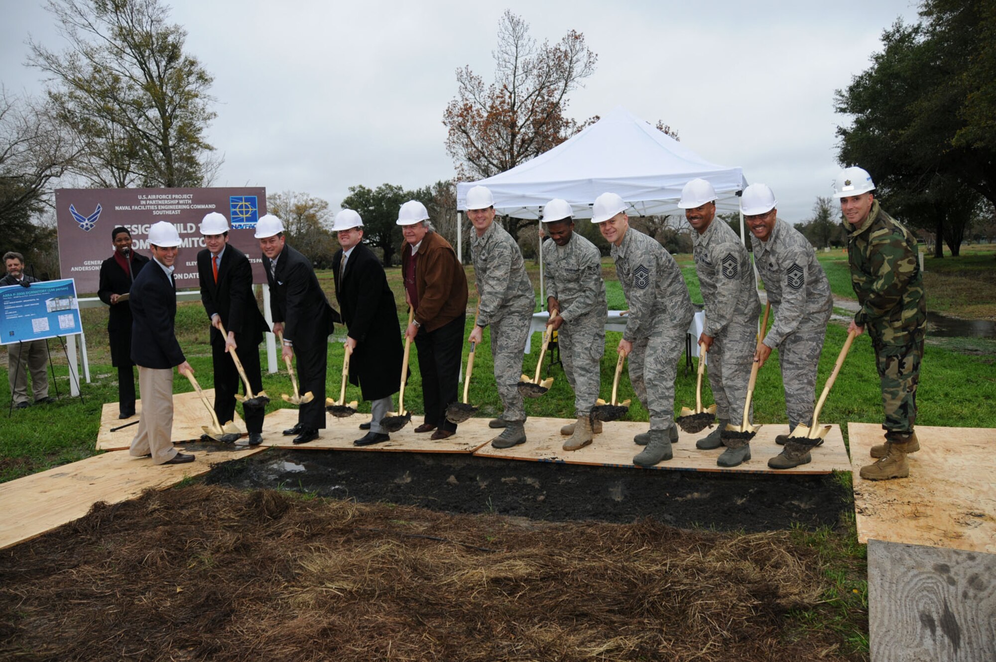 From left, participants in the groundbreaking ceremony Dec. 18 are Jared Christman, Mickey Anderson, John Drace and Steve Bryant, Anderson Drace Joint Venture; Win Ellington, Sen. Thad Cochran's office; Chief Master Sgt. of the Air Force James Roy; Airman 1st Class Mark Landry, 81st Aerospace Medicine Squadron, representing Keesler's current permanent party dorm residents; Brig. Gen. Ian Dickinson, 81st Training Wing commander; Lt. Cmdr. Mark Powell, Keesler's resident officer in charge of construction for Naval Facilities Engineering Command Southeast; Chief Master Sgt. Linus Jordan, 2nd Air Force command chief; and Chief Master Sgt. Lonnie Slater, 81st TRW command chief.  (U.S. Air Force photo by Kemberly Groue)
