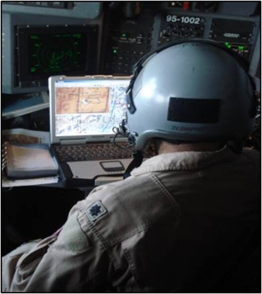 An aircrew member uses the Combat Track II system, the 500th of which was delivered to the field last month.  CT II allows crew aboard the air mobility fleet, as well as on some bombers, to maintain full awareness of friendly and potential hostile aircraft positions. It also alerts them to ground threats, including mobile surface-to-air missile sites.  (Courtesy Photo)