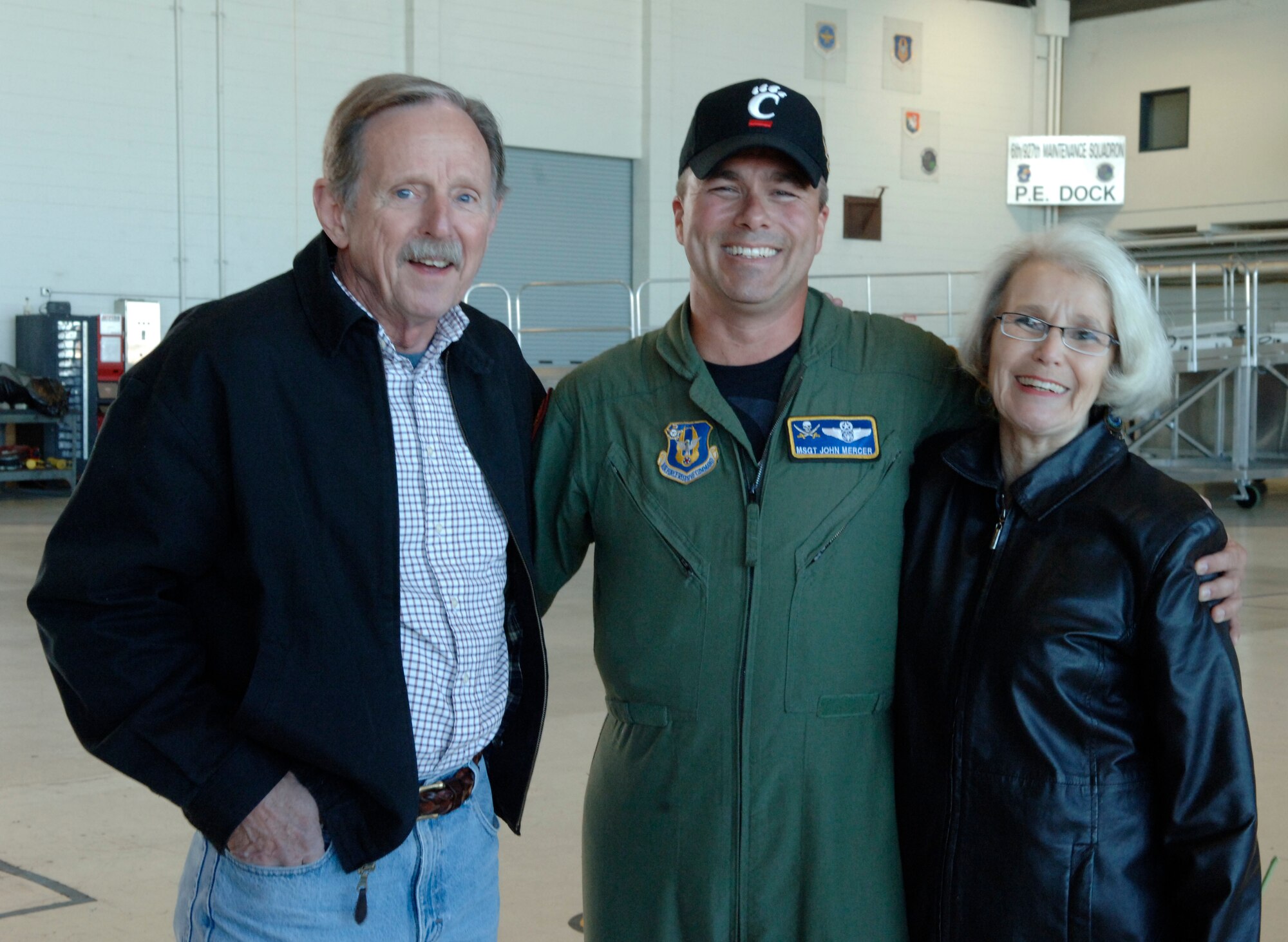 Master Sgt. John Mercer is greeted by his parents Richard and Sarah Pilcher.  Mercer returned from a deployment to Guam on Jan. 2, 2010.
