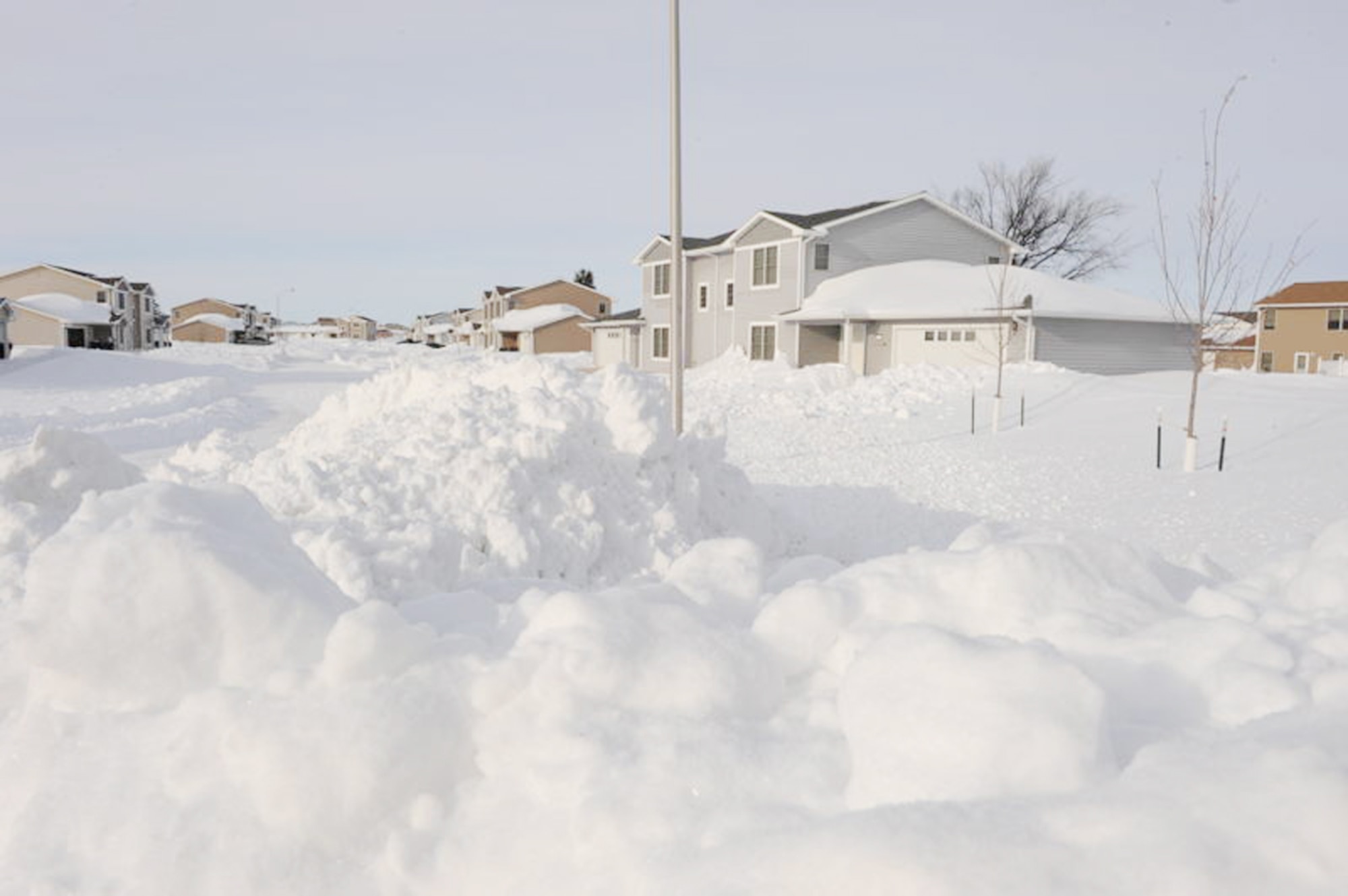 Snow piled up in front of housing Dec. 29, 2009 at Minot Air Force Base, N.D. A Christmas weekend blizzard resulted in 25.7 inches of snow. (U.S. Air Force photo/Staff Sgt. Stacy Moless)