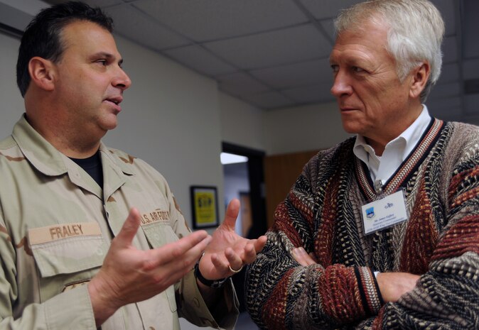 Master Sgt. Stephen Fraley speaks with Jim Geffert during an Expeditionary Combat Skills Training session here Jan. 5. The training was held as part of the honorary commanders 2010 induction and was designed to foster support between the base and the local community. Sergeant Fraley is the NCO in charge of ECST and Mr. Geffert is the honorary commander assigned to the 437th Airlift Wing vice commander. (U.S. Air Force photo/Senior Airman Katie Gieratz)(RELEASED)