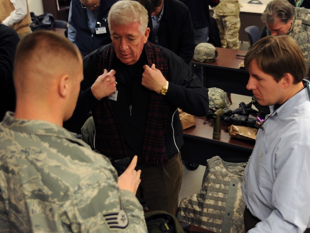 Staff Sgt. John Foster speaks to Bill Moody and Graham Drayton during the honorary commanders induction here Jan. 5. The 2010 induction was the first time honorary commanders had the opportunity to experience the Expeditionary Combat Skills Training Airmen are required to complete prior to deployments. Sergeant Foster is a combat arms instructor with the 437th Security Forces Squadron, Mr. Moody is the honorary commander assigned to the 628th Air Base Wing commander and Mr. Drayton is the honorary commander assigned to the 628 ABW command chief. (U.S. Air Force photo/Senior Airman Katie Gieratz)(RELEASED)