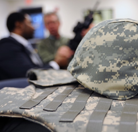 Honorary commanders inspect their weapons before donning interceptor body armor and helmets during the honorary commanders induction here Jan. 5. The induction included training hosted by the 437th Security Forces Squadron Expeditionary Combat Skills Training flight as part of a program to provide a unique opportunity for members of the Charleston area to shadow squadron and group commanders at Charleston AFB. (U.S. Air Force photo/Senior Airman Katie Gieratz)(RELEASED)