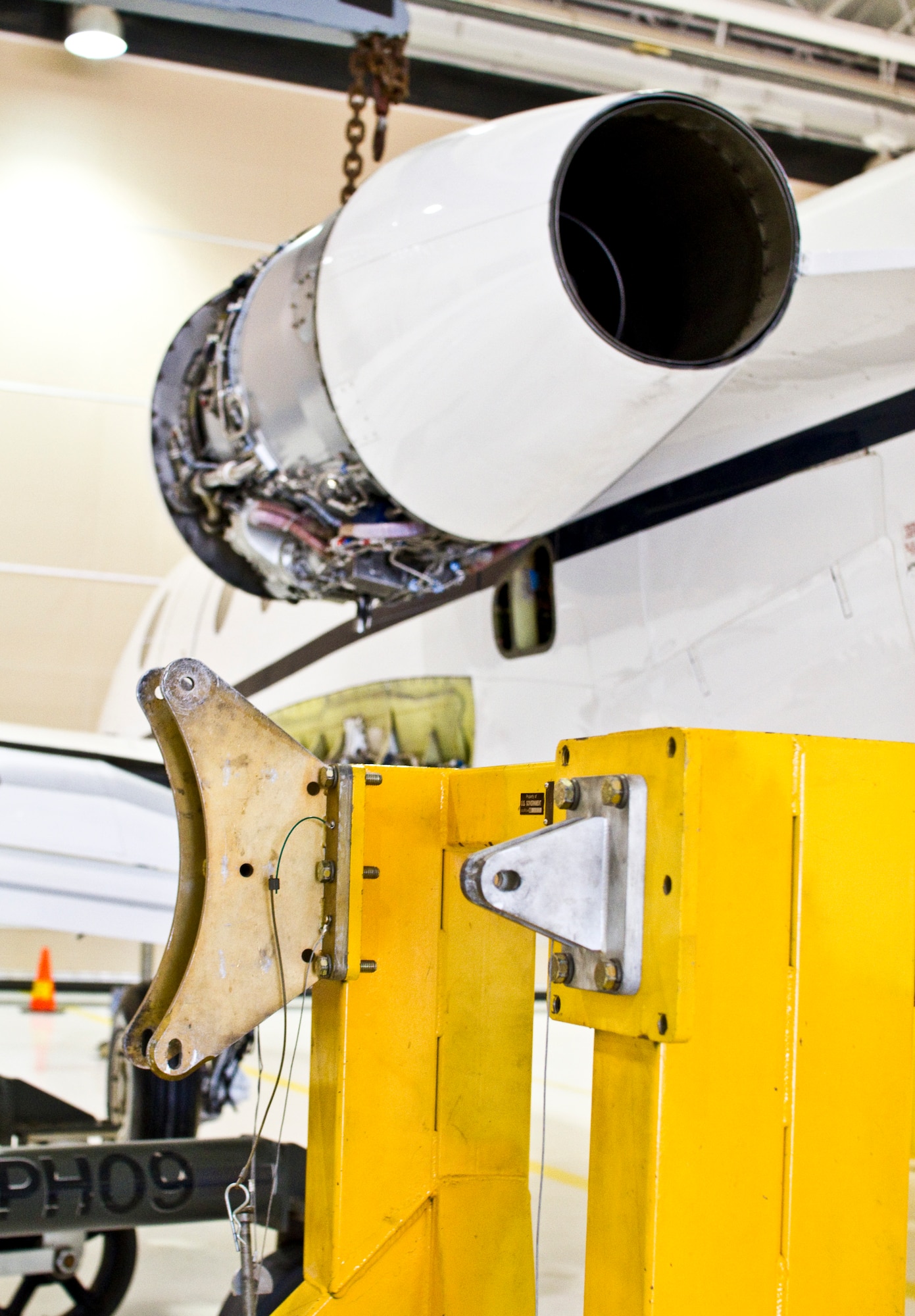 An engine stand sits below a T-1A Jayhawk Beech 400 engine ready to be lowered down by the engine hoist as it was Dec. 1 during a routine engine removal. (U.S. Air Force photo/2nd Lt. Paul Whittaker)